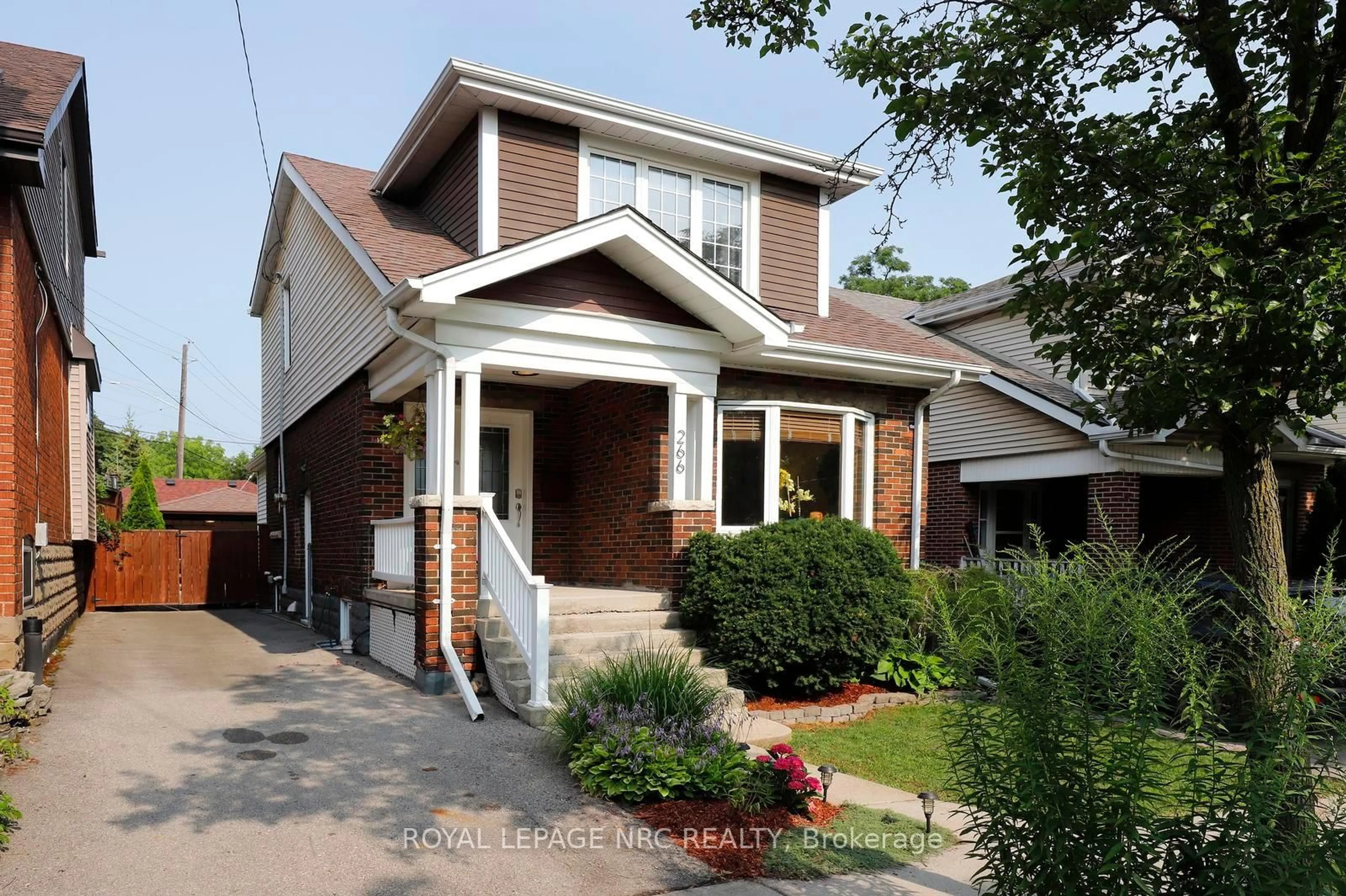 Home with brick exterior material, street for 266 London St, Hamilton Ontario L8K 2H2