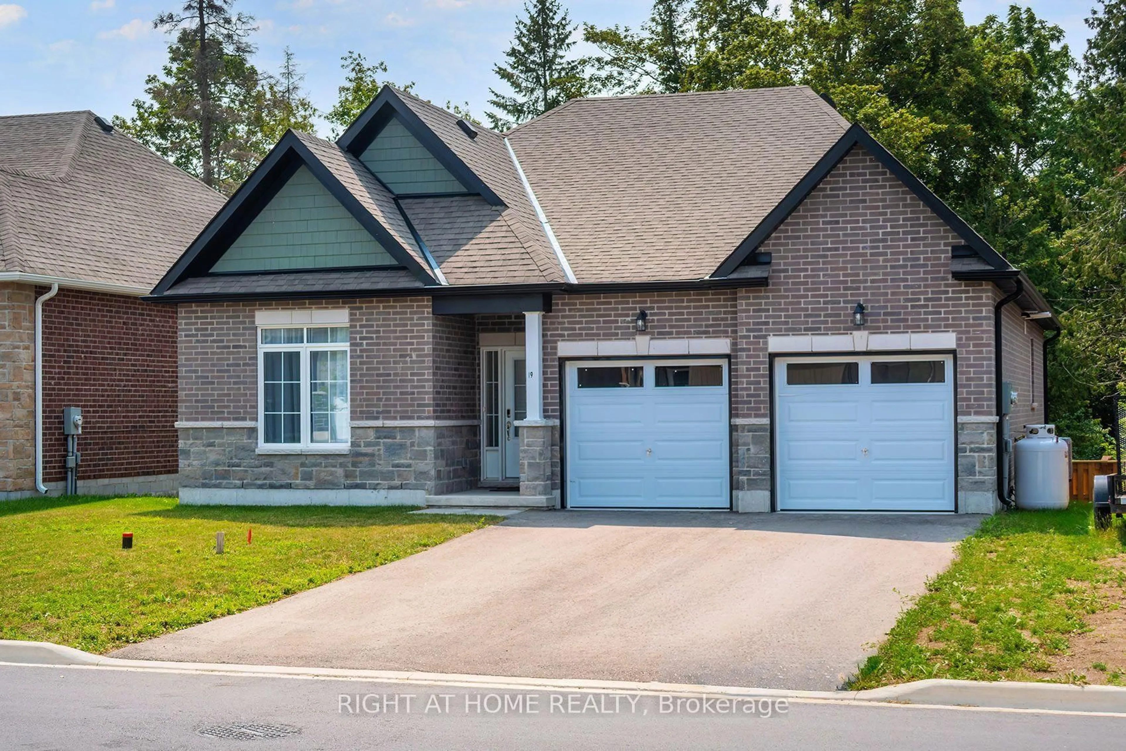 Home with brick exterior material, street for 19 Hillcroft Way, Kawartha Lakes Ontario K0M 1A0