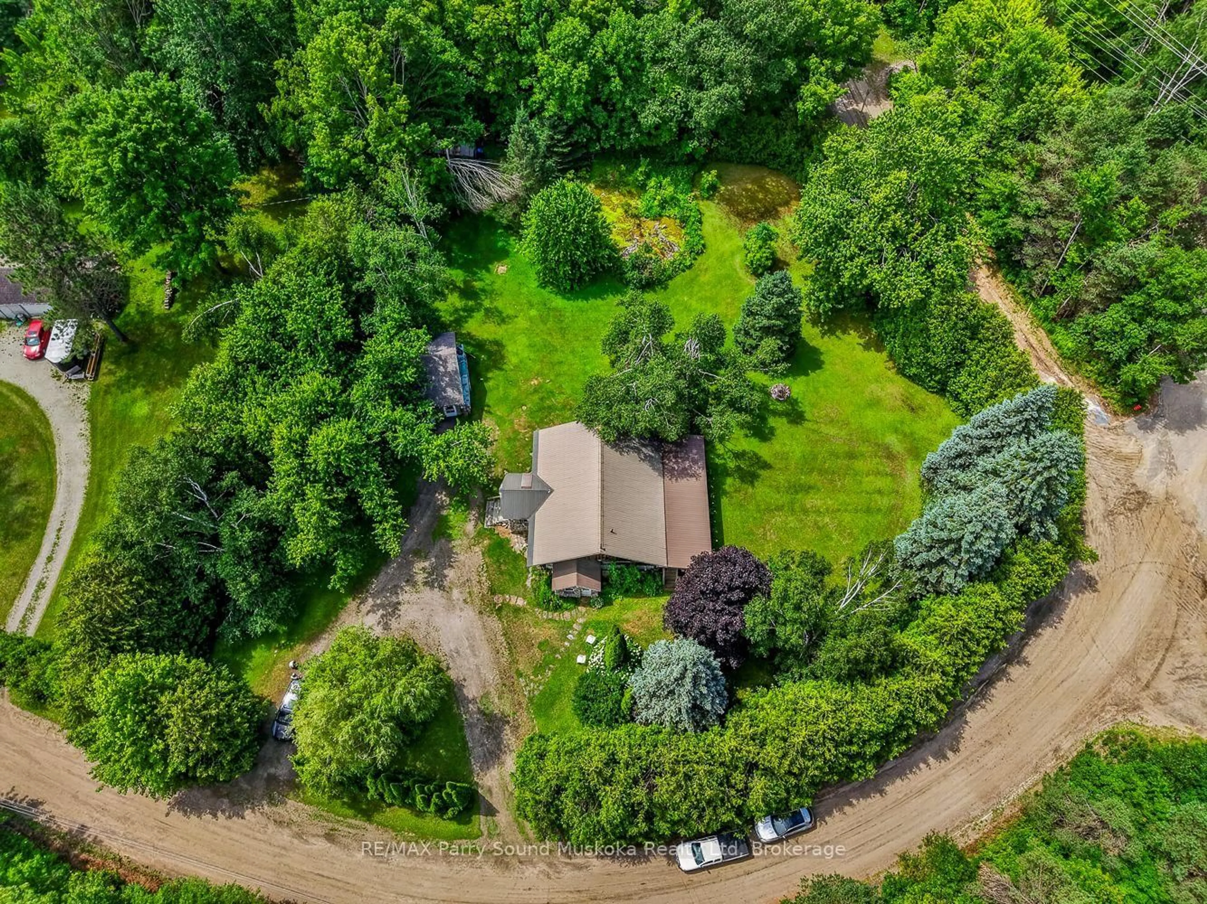 A pic from outside/outdoor area/front of a property/back of a property/a pic from drone, forest/trees view for 1011 Orange Lodge Rd, Muskoka Lakes Ontario P0C 1H0