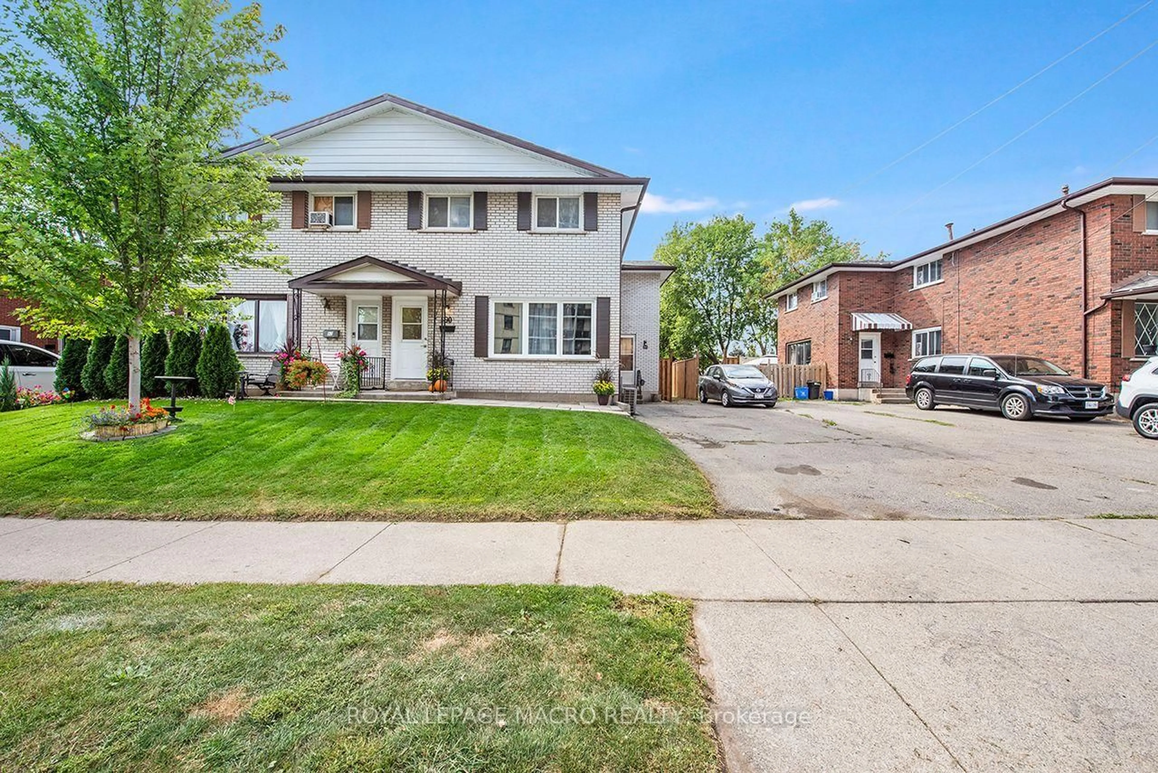 Home with brick exterior material, street for 64 & 66 Delawana Dr, Hamilton Ontario L8E 1G4
