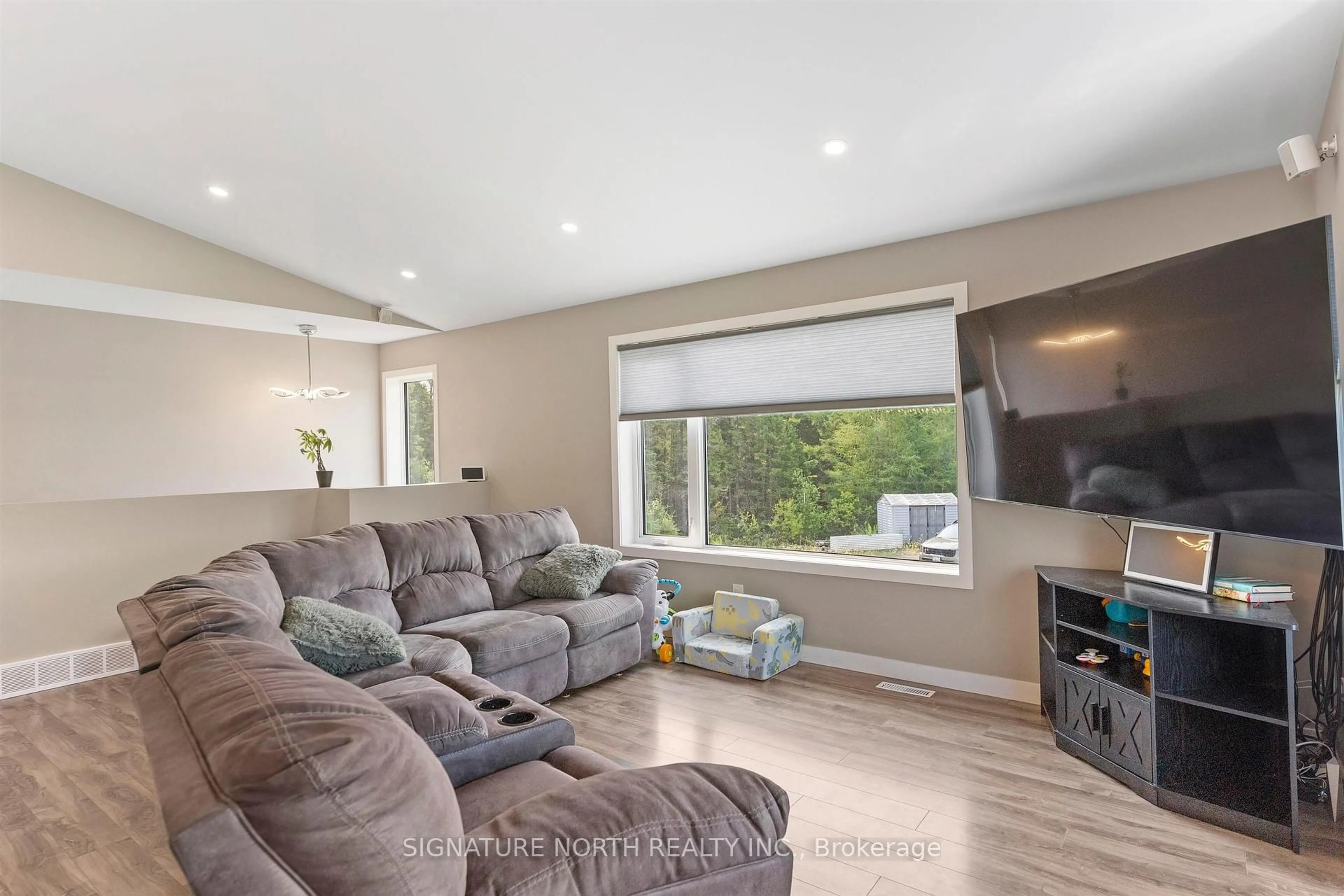 Living room with furniture, wood/laminate floor for 510 Highway 527, Shuniah Ontario P7A 0N2