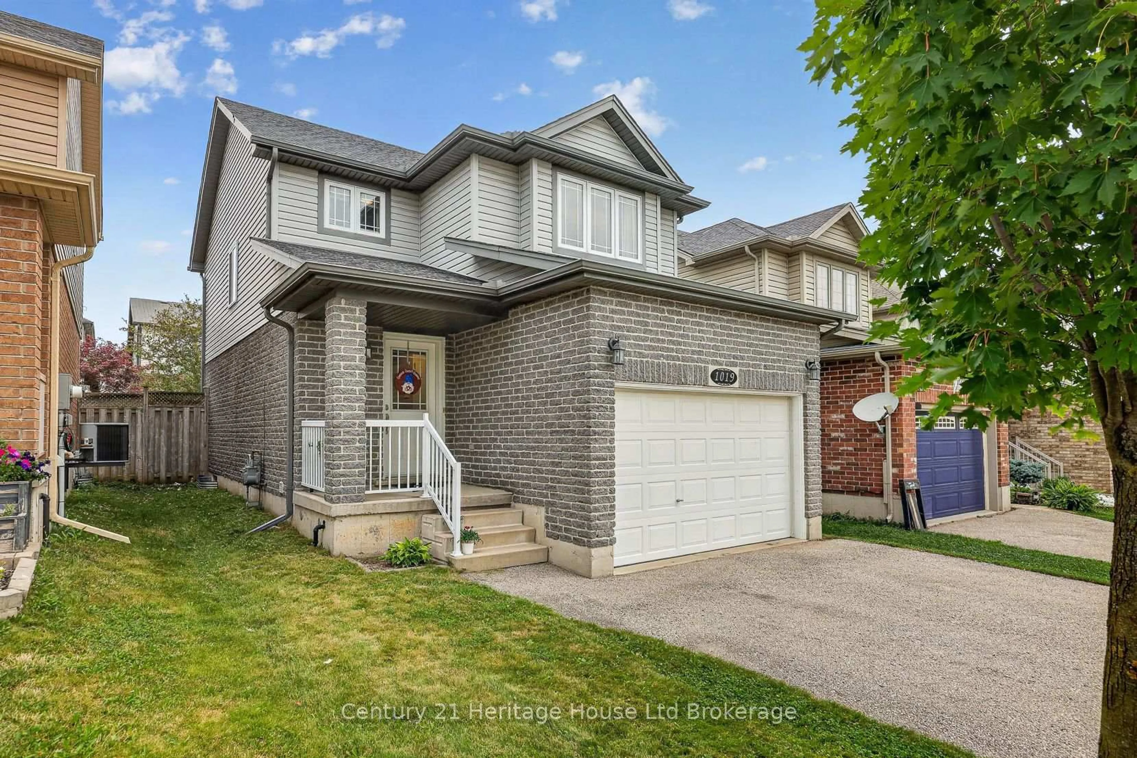 Home with brick exterior material, street for 1019 Marquette Dr, Woodstock Ontario N4V 0A9