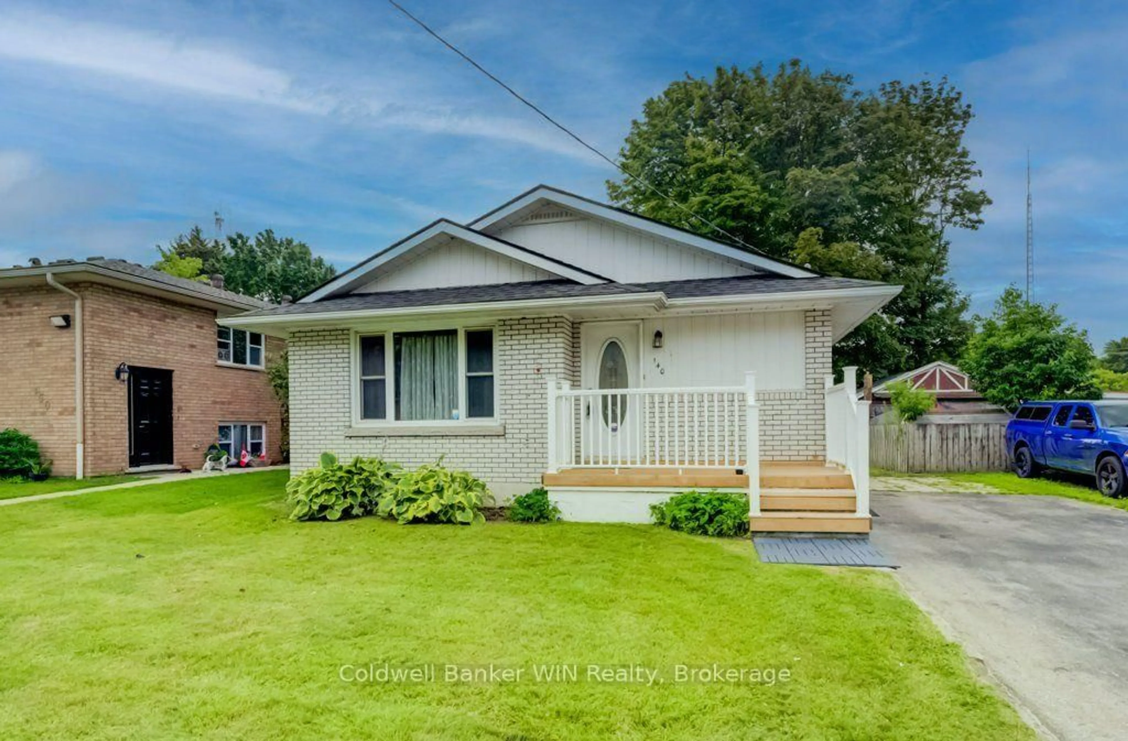 Home with vinyl exterior material, street for 140 Queen St, Wellington North Ontario N0G 2L3