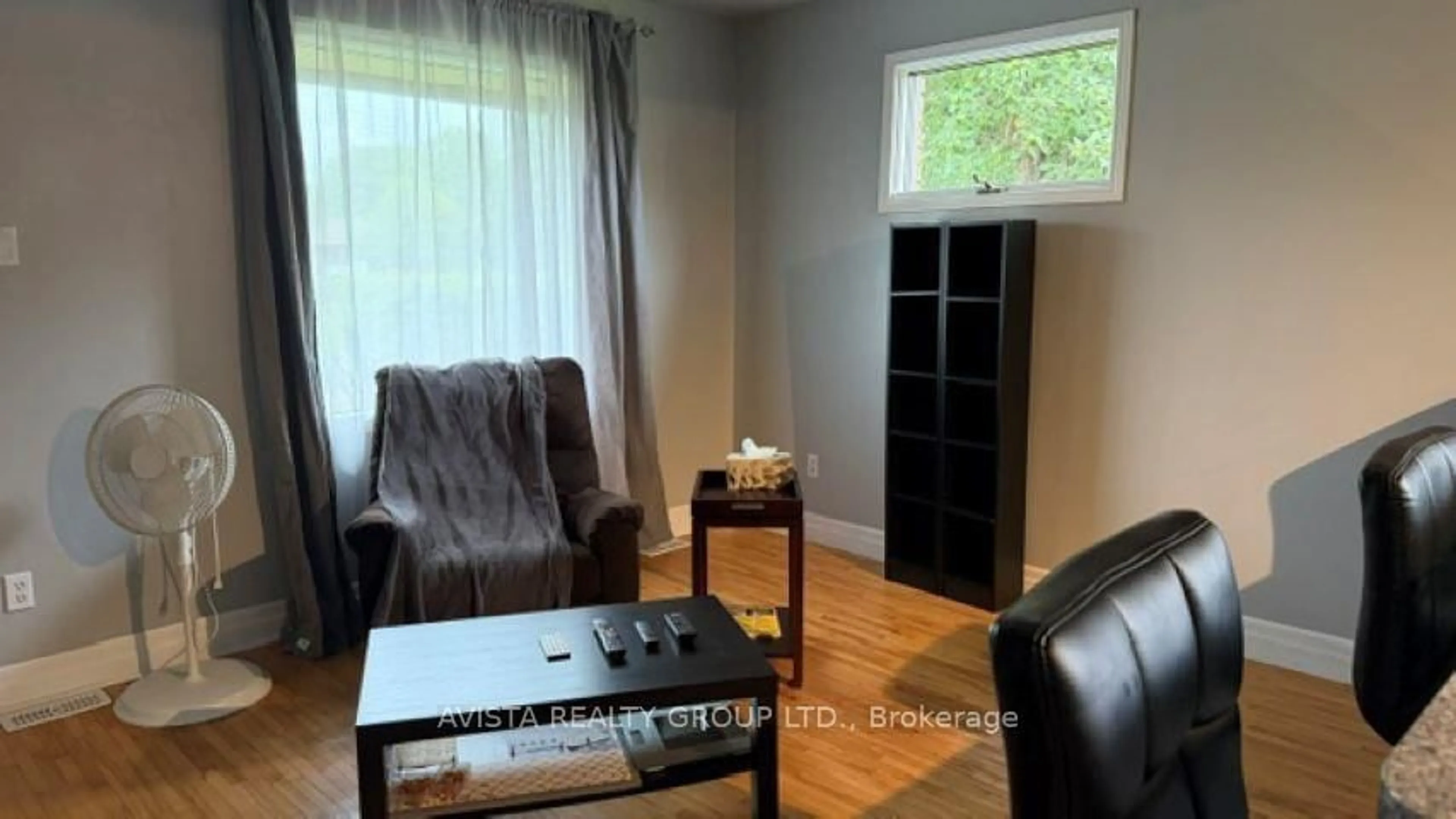 Living room with furniture, wood/laminate floor for 700 Francis St, Thunder Bay Ontario P7E 4E1