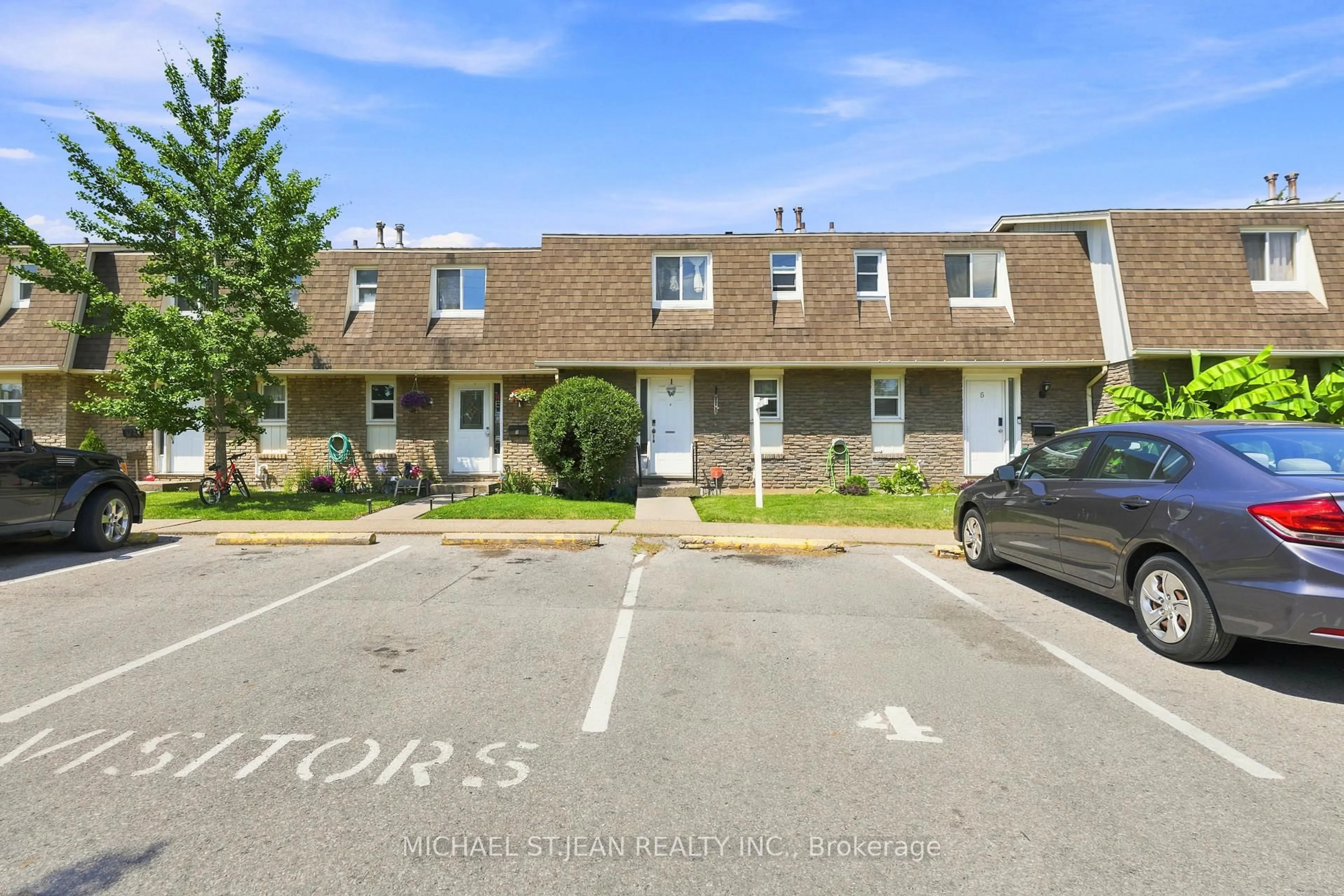 A pic from outside/outdoor area/front of a property/back of a property/a pic from drone, street for 131 Rockwood Ave #4, St. Catharines Ontario L2P 3K4