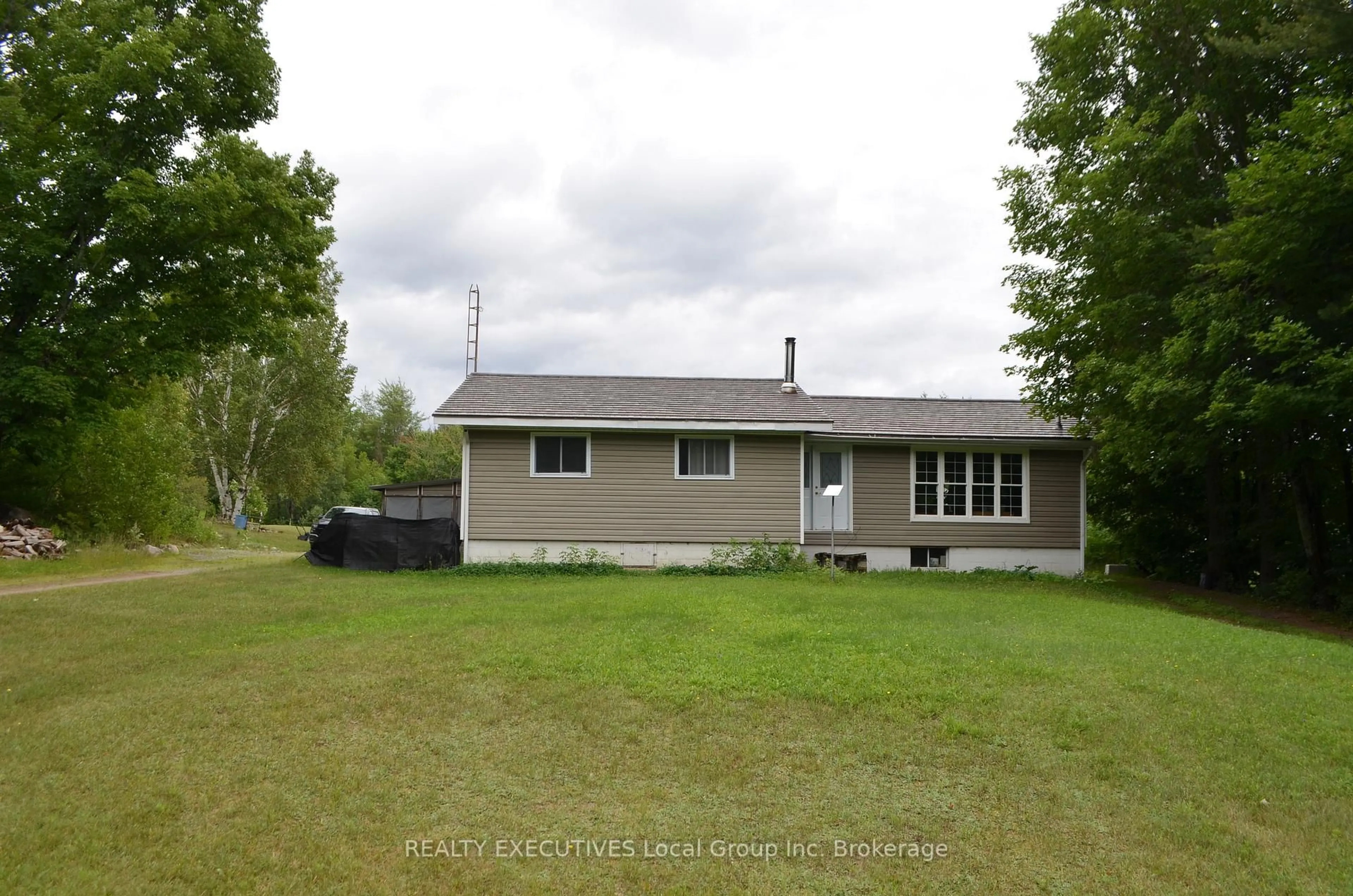 A pic from outside/outdoor area/front of a property/back of a property/a pic from drone, unknown for 1405 Pioneer Rd, Chisholm Ontario P0H 1Z0