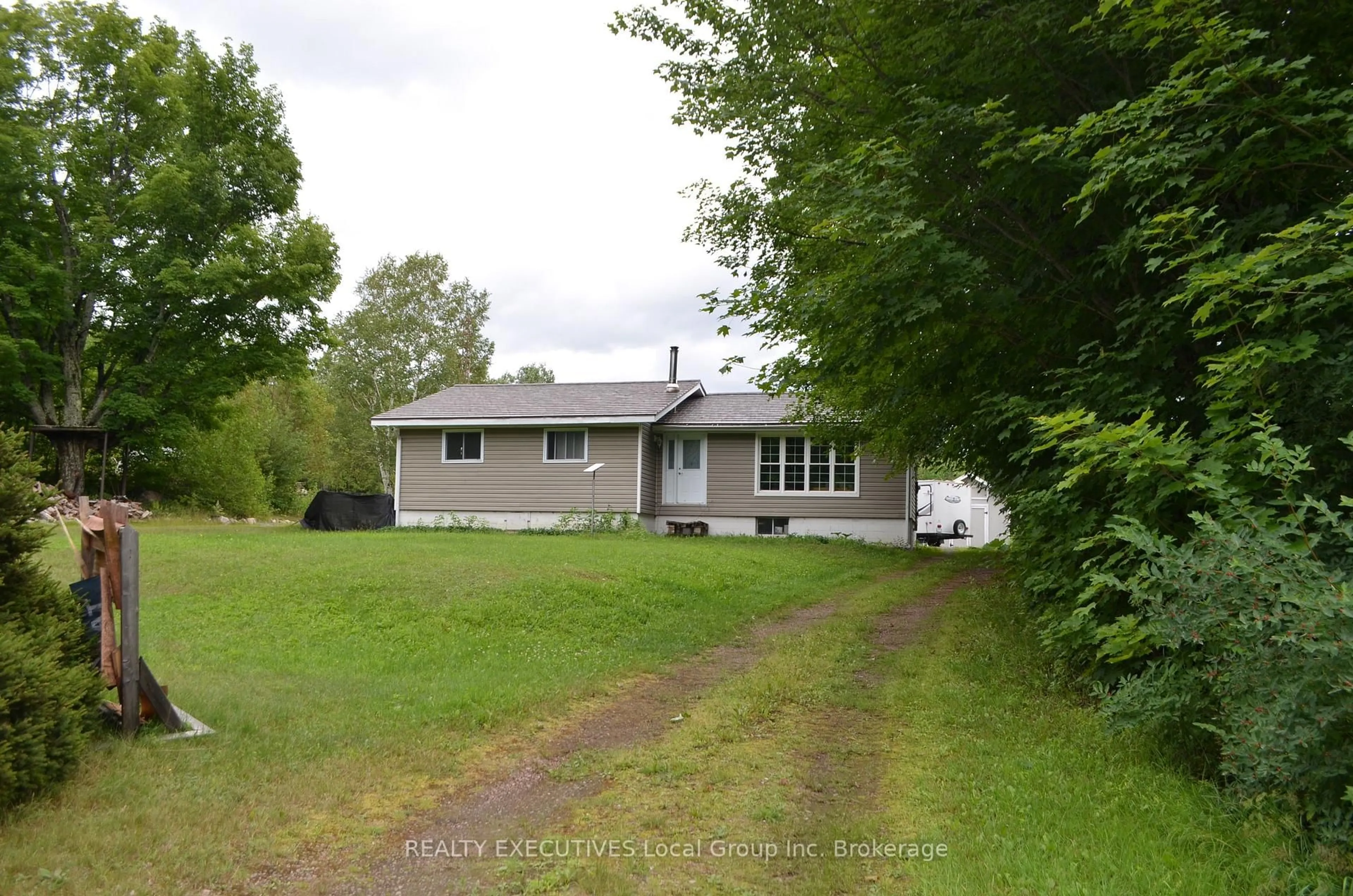 A pic from outside/outdoor area/front of a property/back of a property/a pic from drone, street for 1405 Pioneer Rd, Chisholm Ontario P0H 1Z0