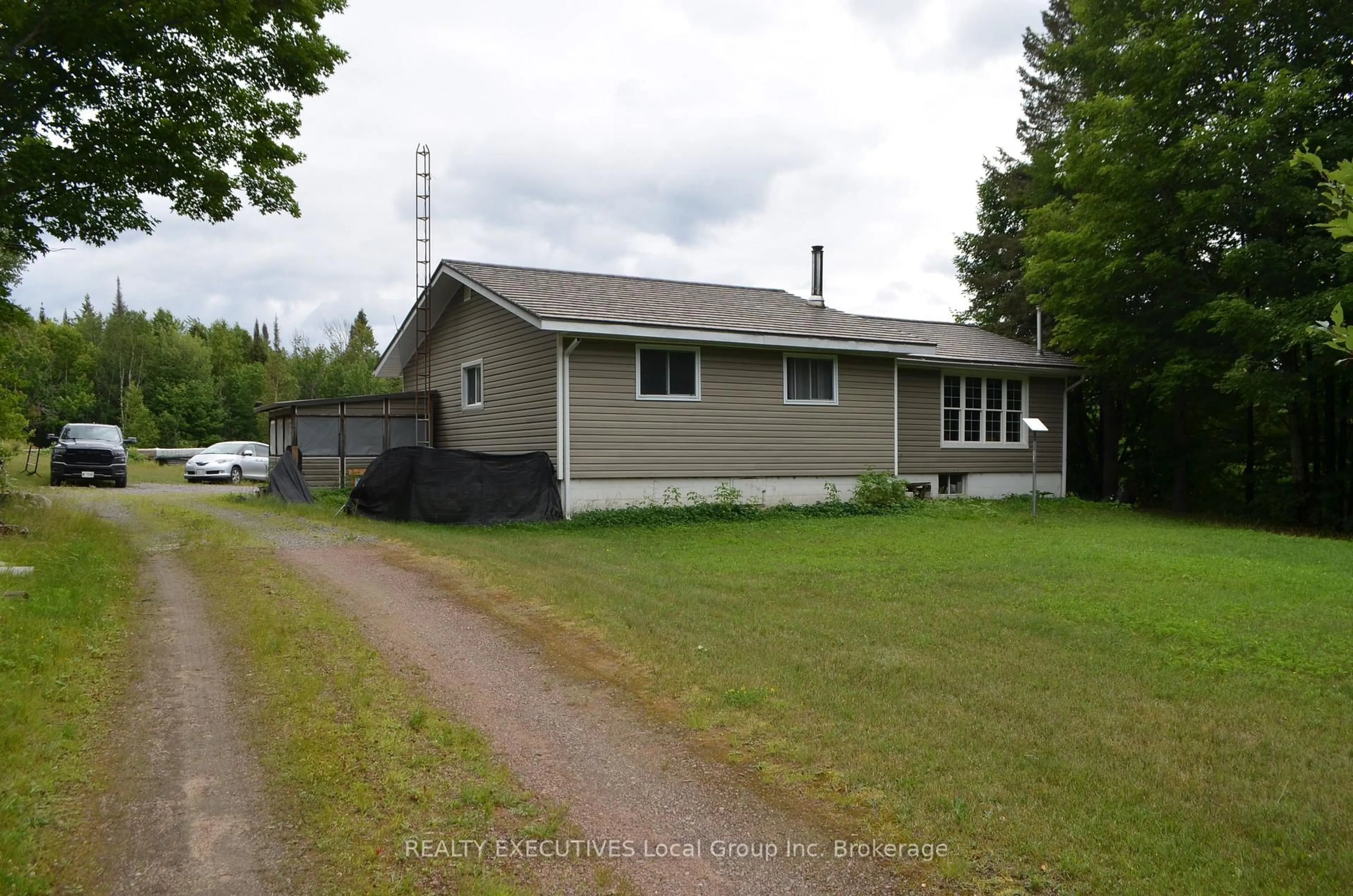 A pic from outside/outdoor area/front of a property/back of a property/a pic from drone, street for 1405 Pioneer Rd, Chisholm Ontario P0H 1Z0