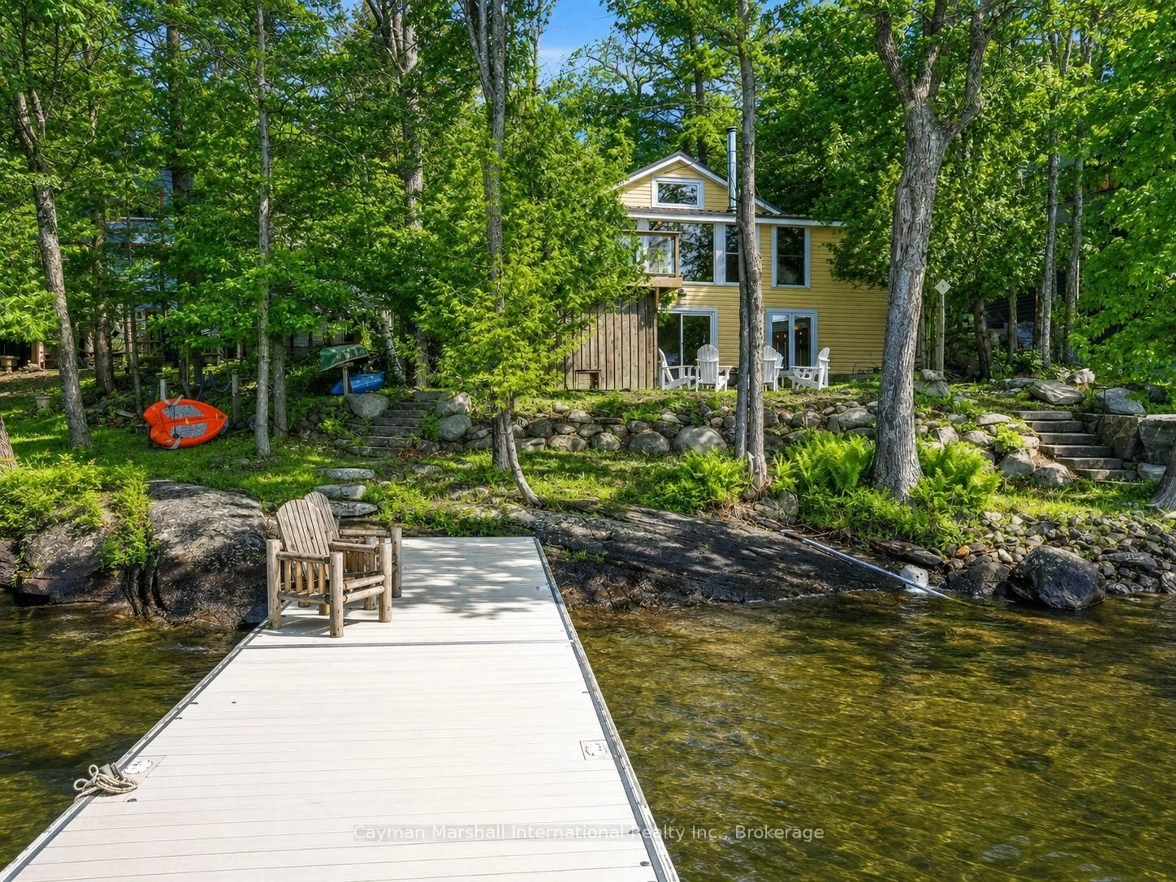 A pic from outside/outdoor area/front of a property/back of a property/a pic from drone, water/lake/river/ocean view for 1020 Ennis Bay Rd, Bracebridge Ontario P1P 1R1