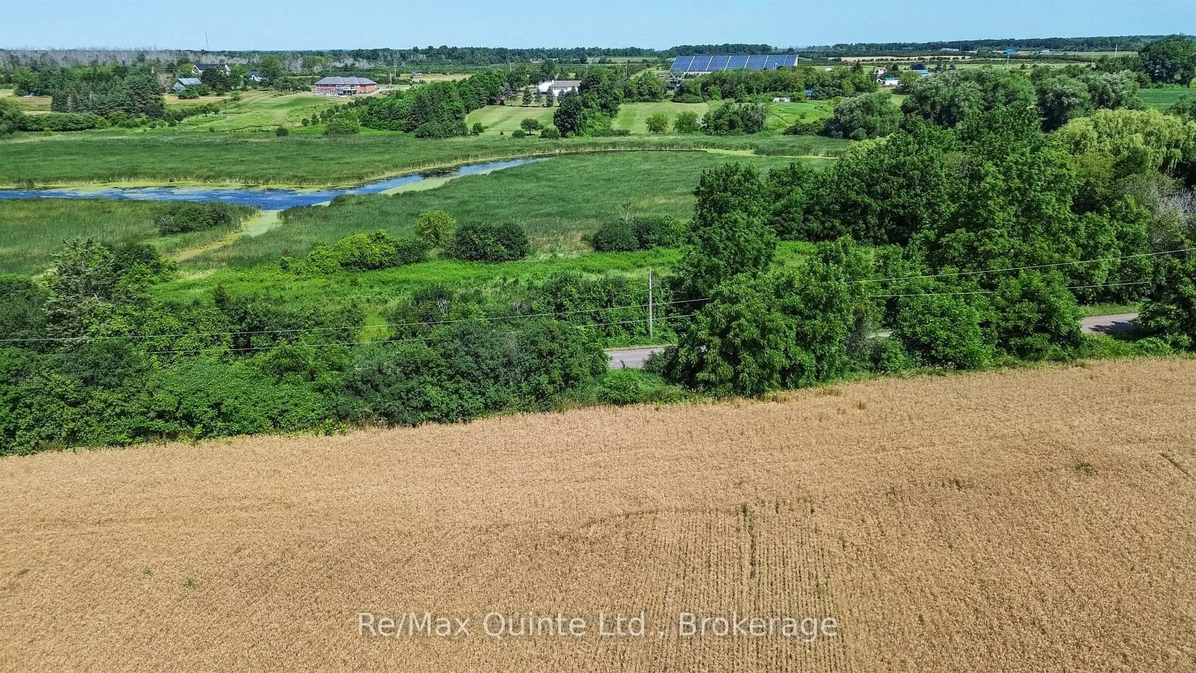 A pic from outside/outdoor area/front of a property/back of a property/a pic from drone, water/lake/river/ocean view for 214 Pleasant Bay Rd, Prince Edward County Ontario K0K 2J0