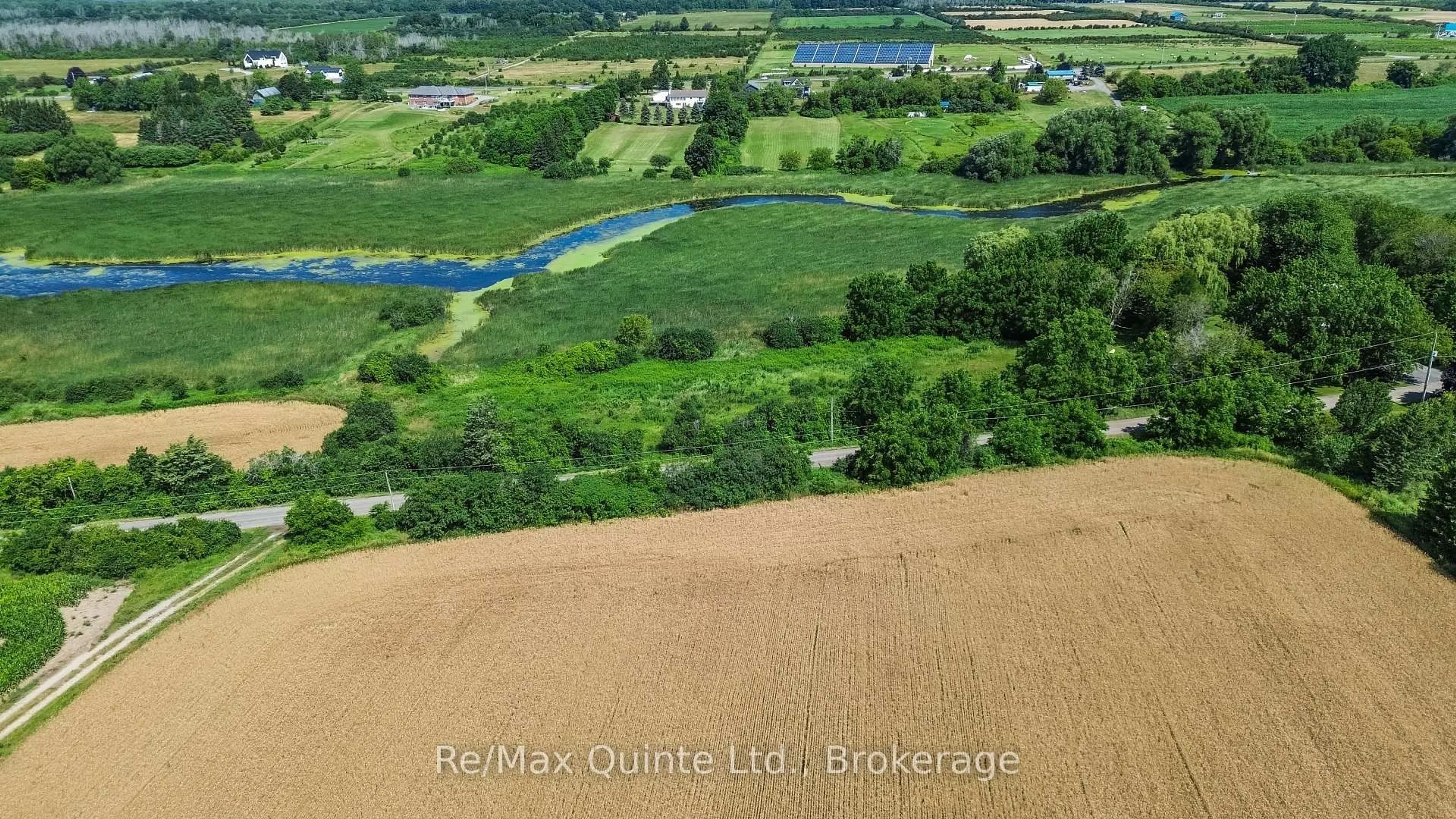 A pic from outside/outdoor area/front of a property/back of a property/a pic from drone, water/lake/river/ocean view for 214 Pleasant Bay Rd, Prince Edward County Ontario K0K 2J0