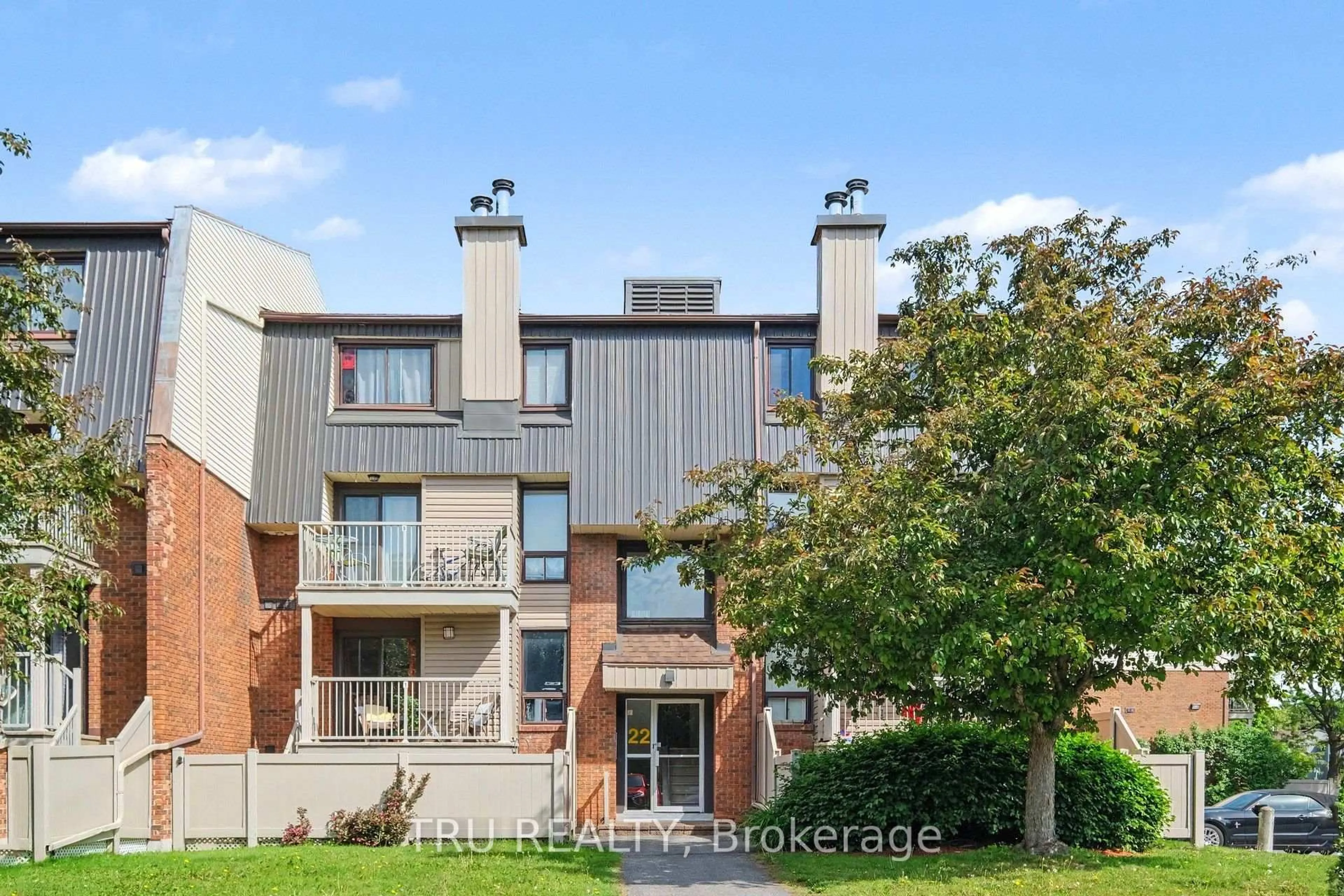Home with brick exterior material, street for 22 Sweetbriar Circ #8, Ottawa Ontario K2J 2K4