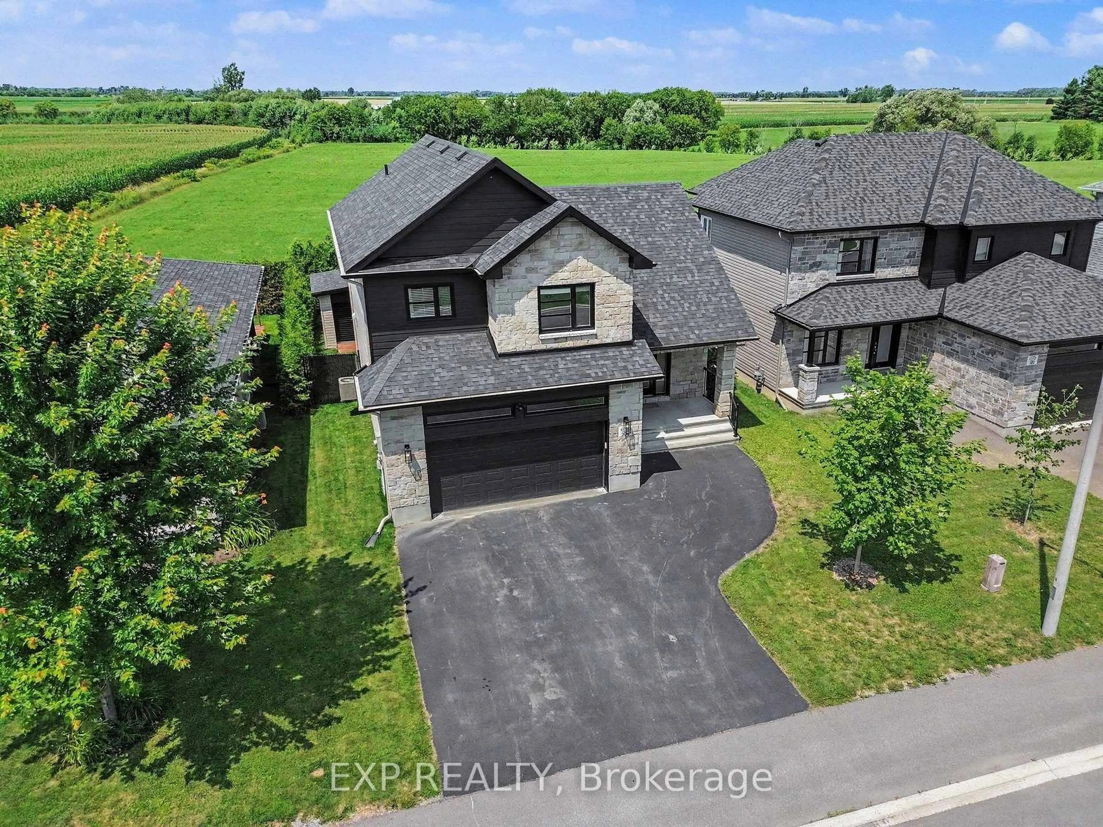 A pic from outside/outdoor area/front of a property/back of a property/a pic from drone, street for 306 Moisson St, Russell Ontario K0A 1W0