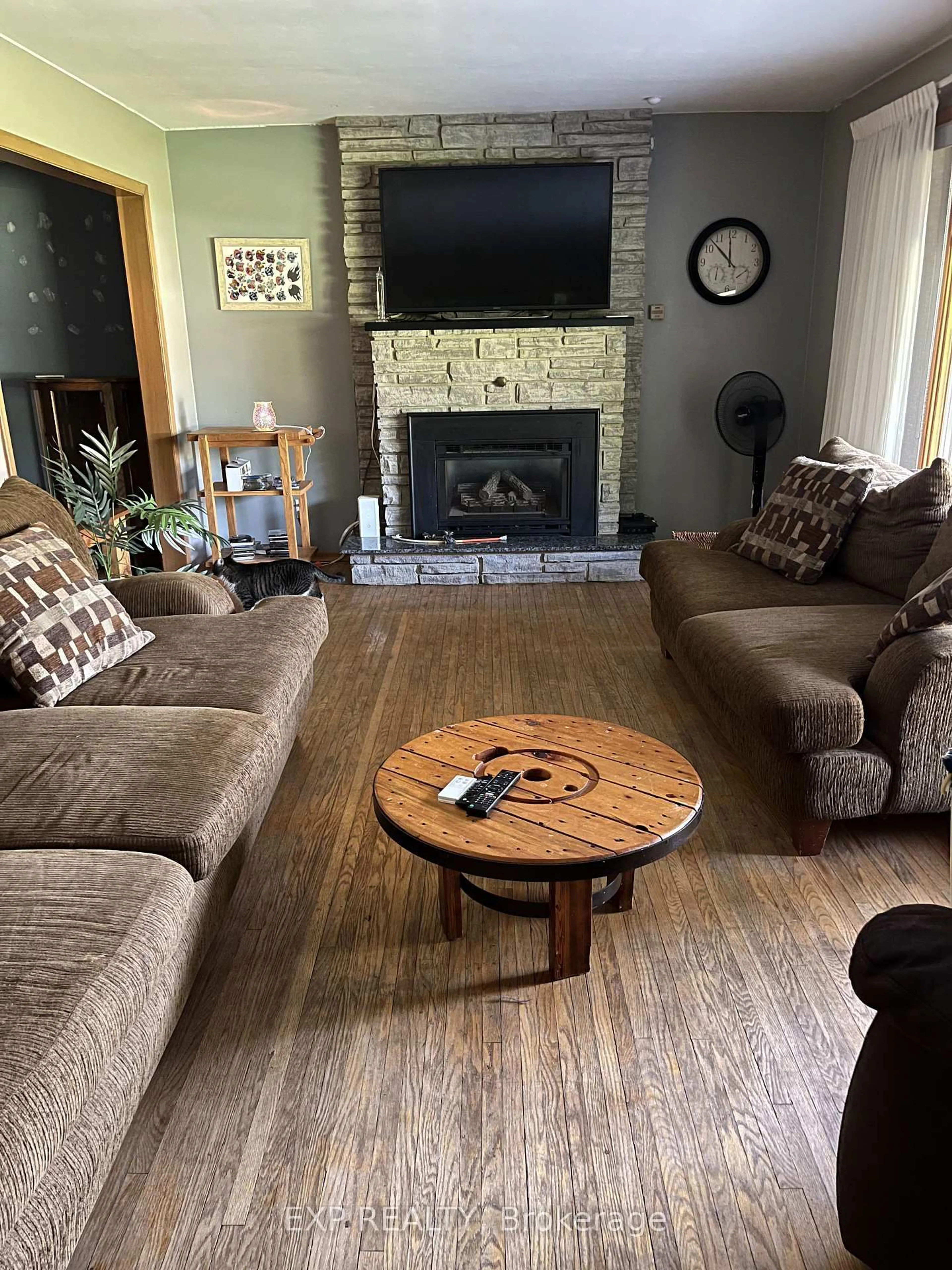 Living room with furniture, wood/laminate floor for 120 Huron Ave, Middlesex Centre Ontario N0L 1R0