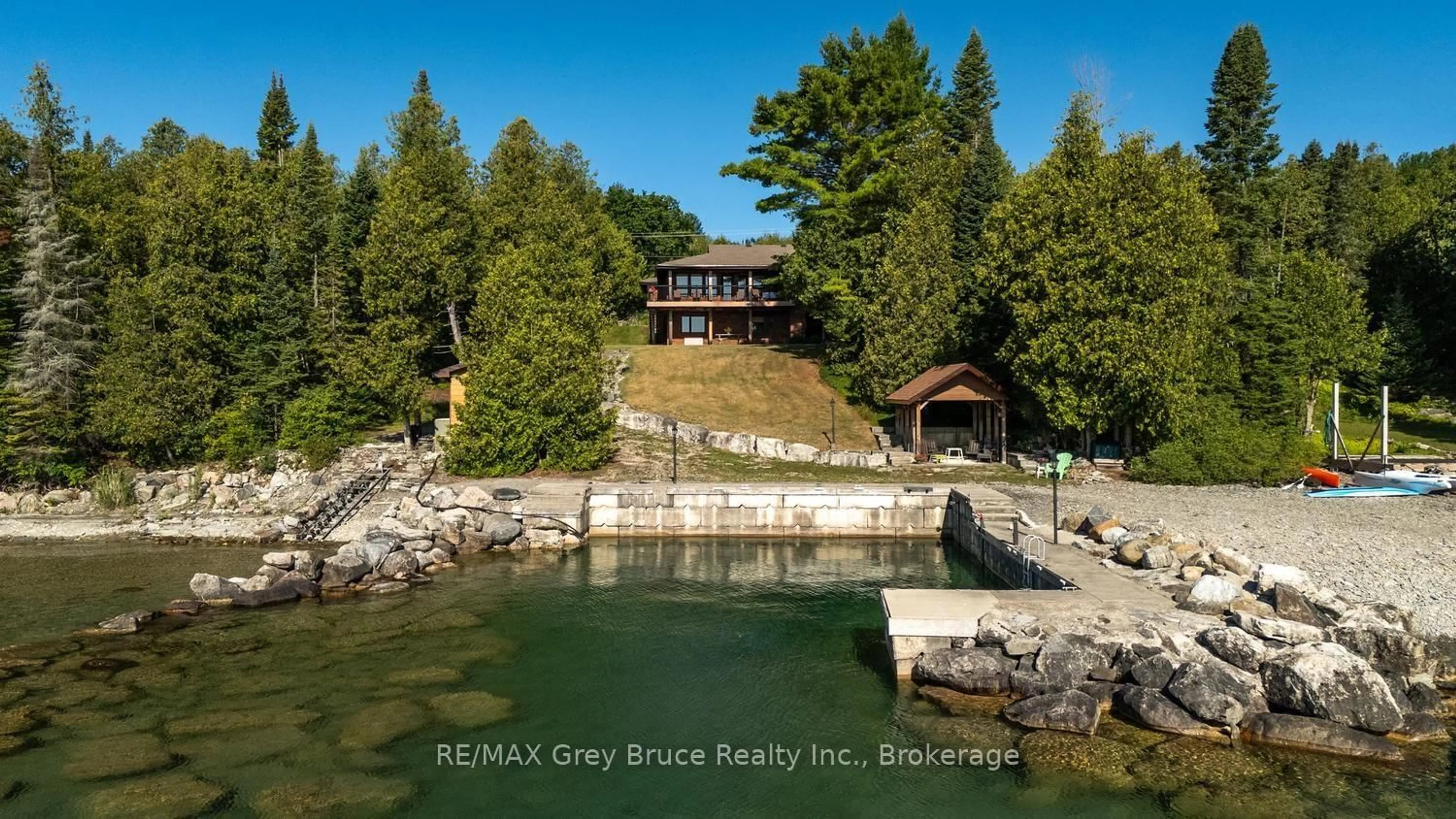 A pic from outside/outdoor area/front of a property/back of a property/a pic from drone, water/lake/river/ocean view for 491 Balmy Beach Rd, Georgian Bluffs Ontario N4K 5N4