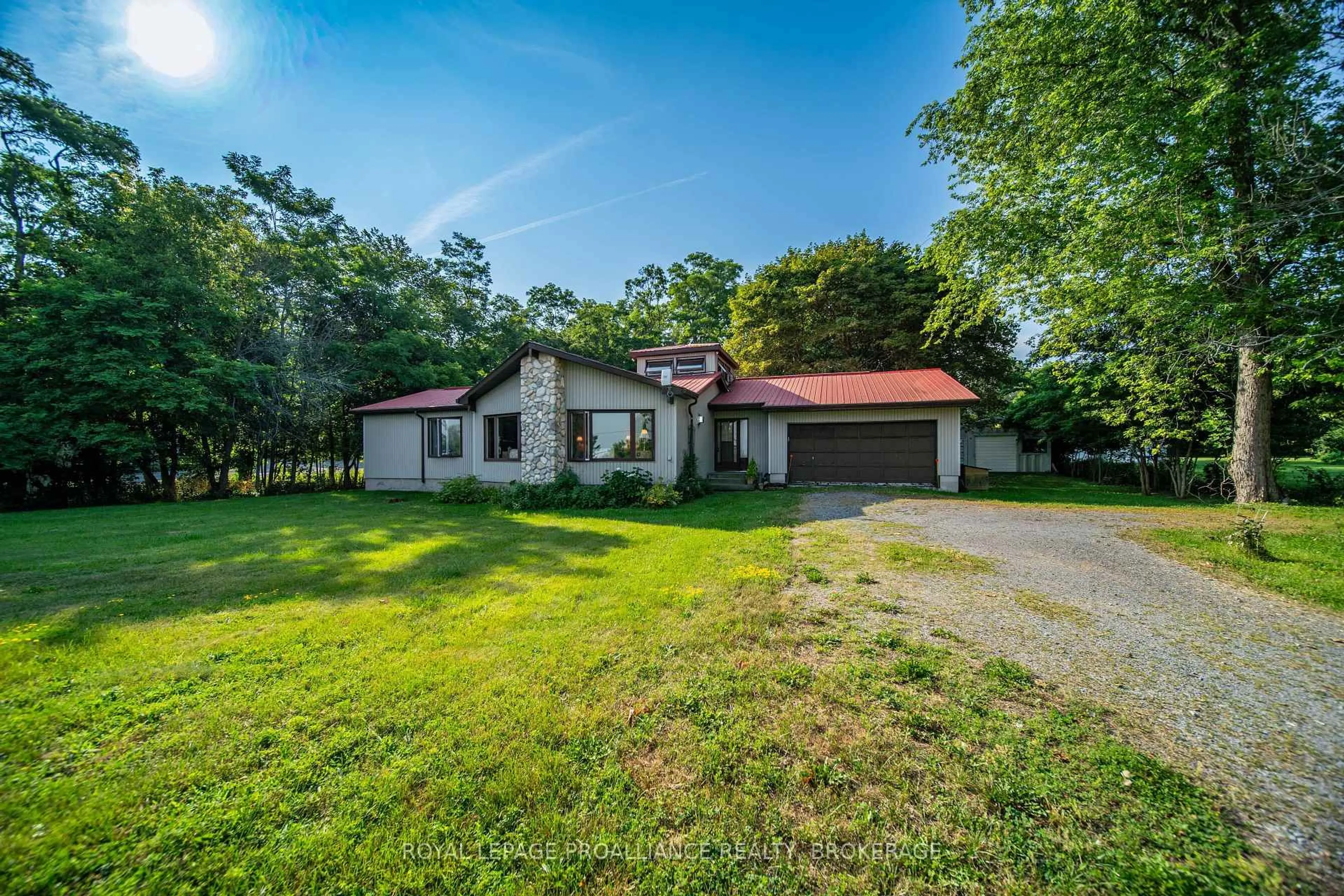 A pic from outside/outdoor area/front of a property/back of a property/a pic from drone, unknown for 1039 Highway 96, Wolfe Island Ontario K0H 2Y0