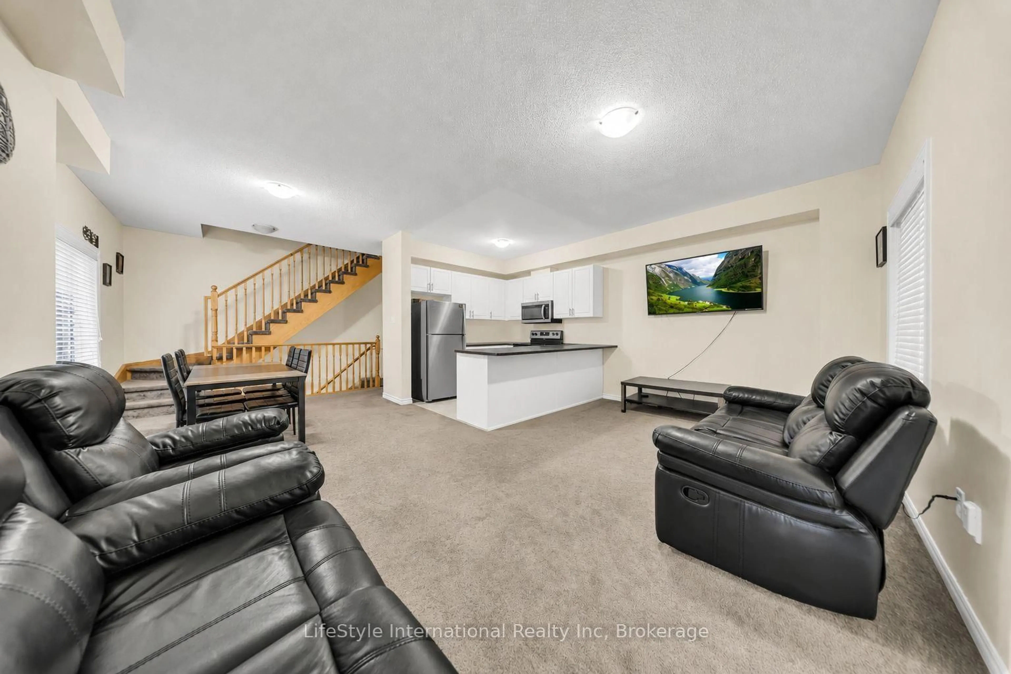Living room with furniture, unknown for 88 Decorso Dr #87, Guelph Ontario N1L 0A9