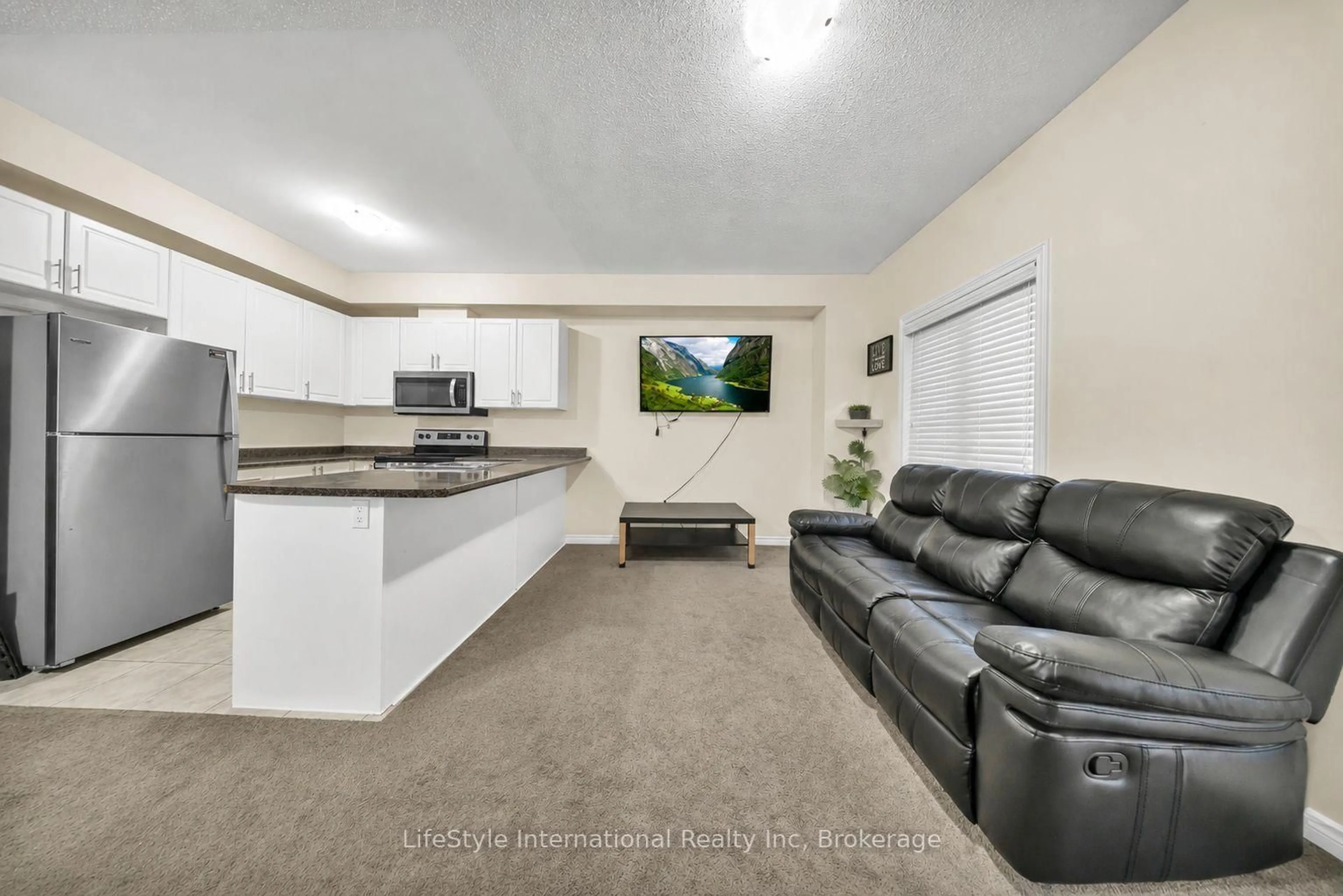 Living room with furniture, unknown for 88 Decorso Dr #87, Guelph Ontario N1L 0A9