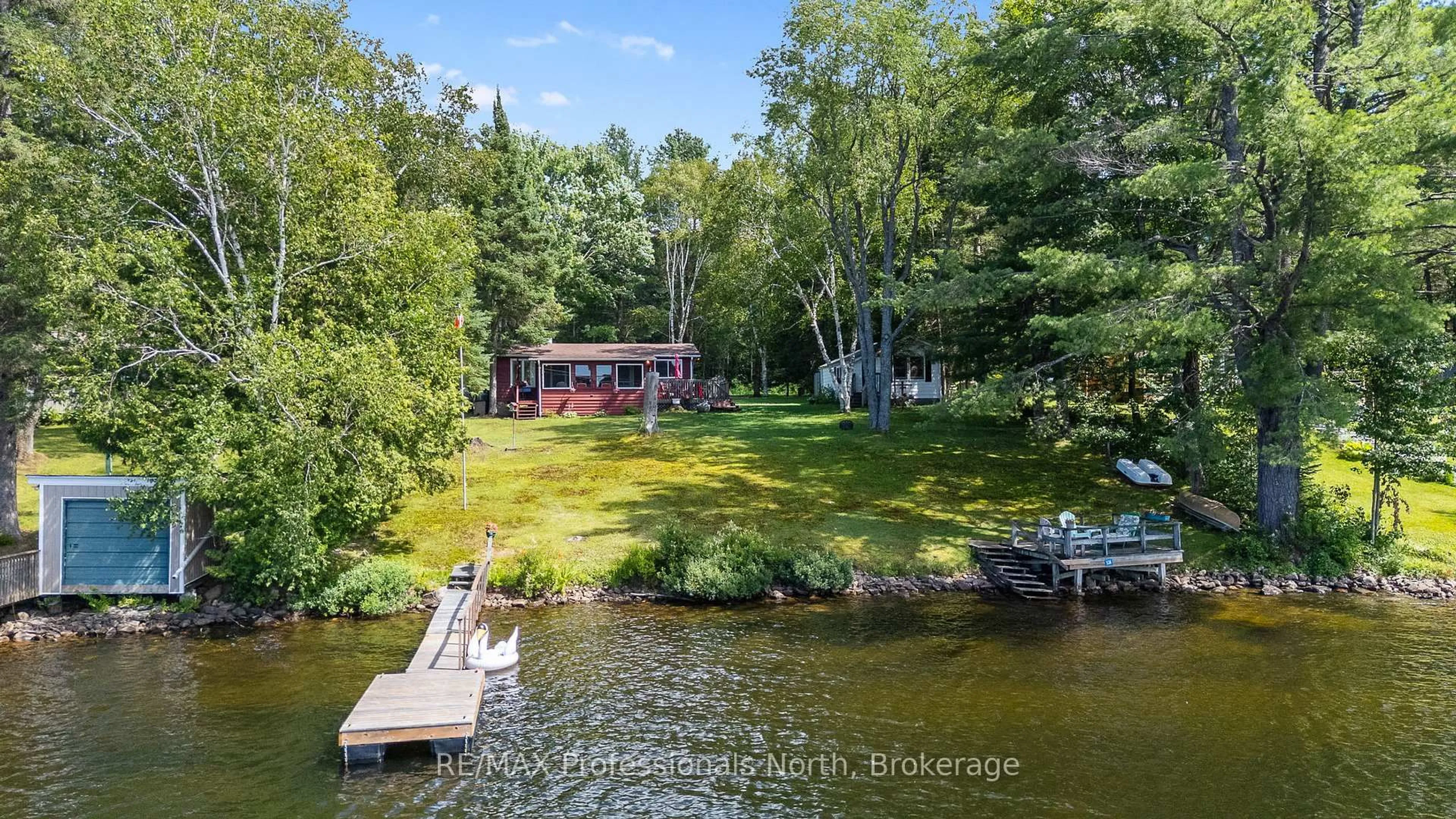 A pic from outside/outdoor area/front of a property/back of a property/a pic from drone, water/lake/river/ocean view for 1214 OLIVER Rd, Algonquin Highlands Ontario K0M 1S0