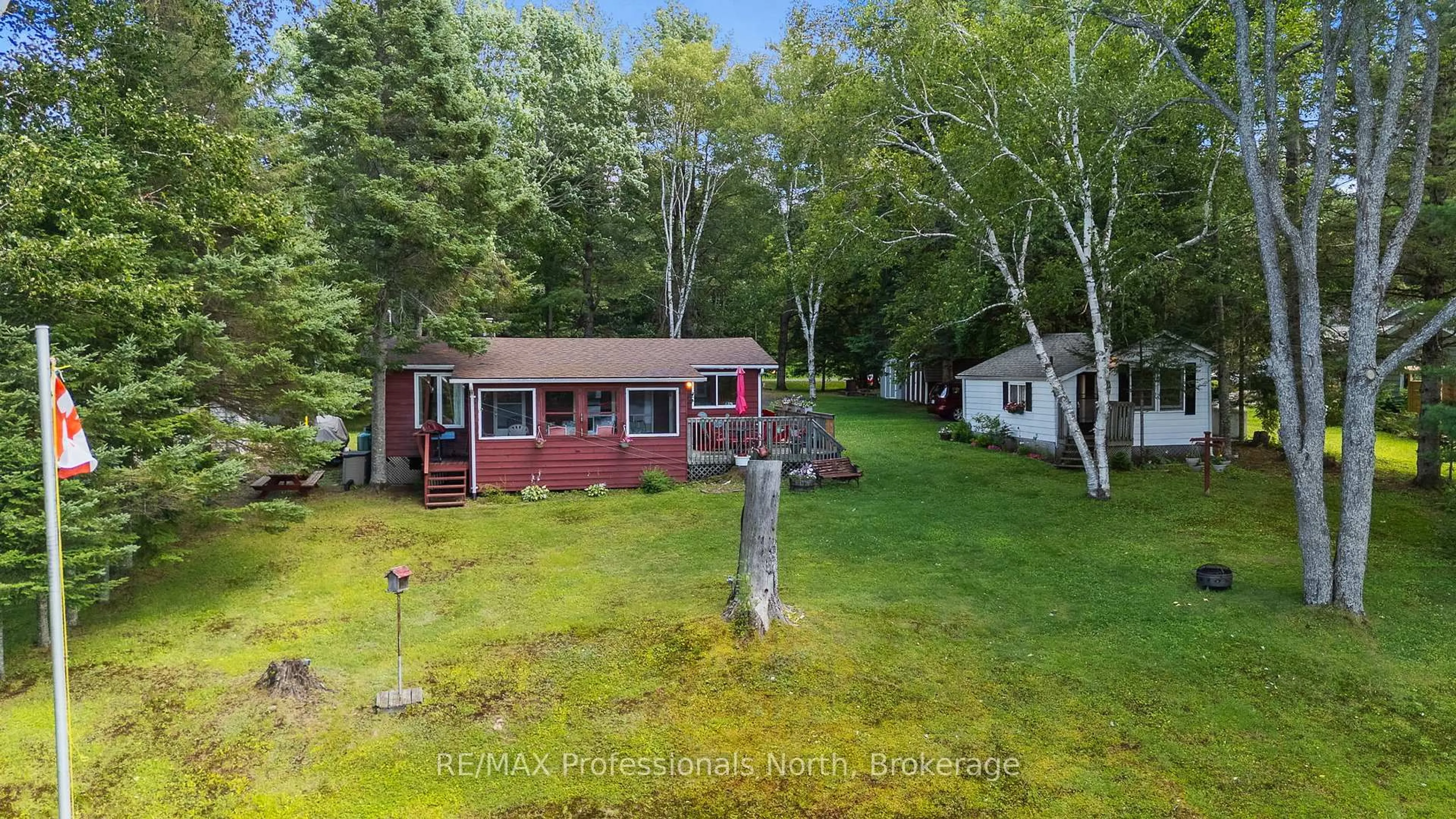 A pic from outside/outdoor area/front of a property/back of a property/a pic from drone, water/lake/river/ocean view for 1214 OLIVER Rd, Algonquin Highlands Ontario K0M 1S0