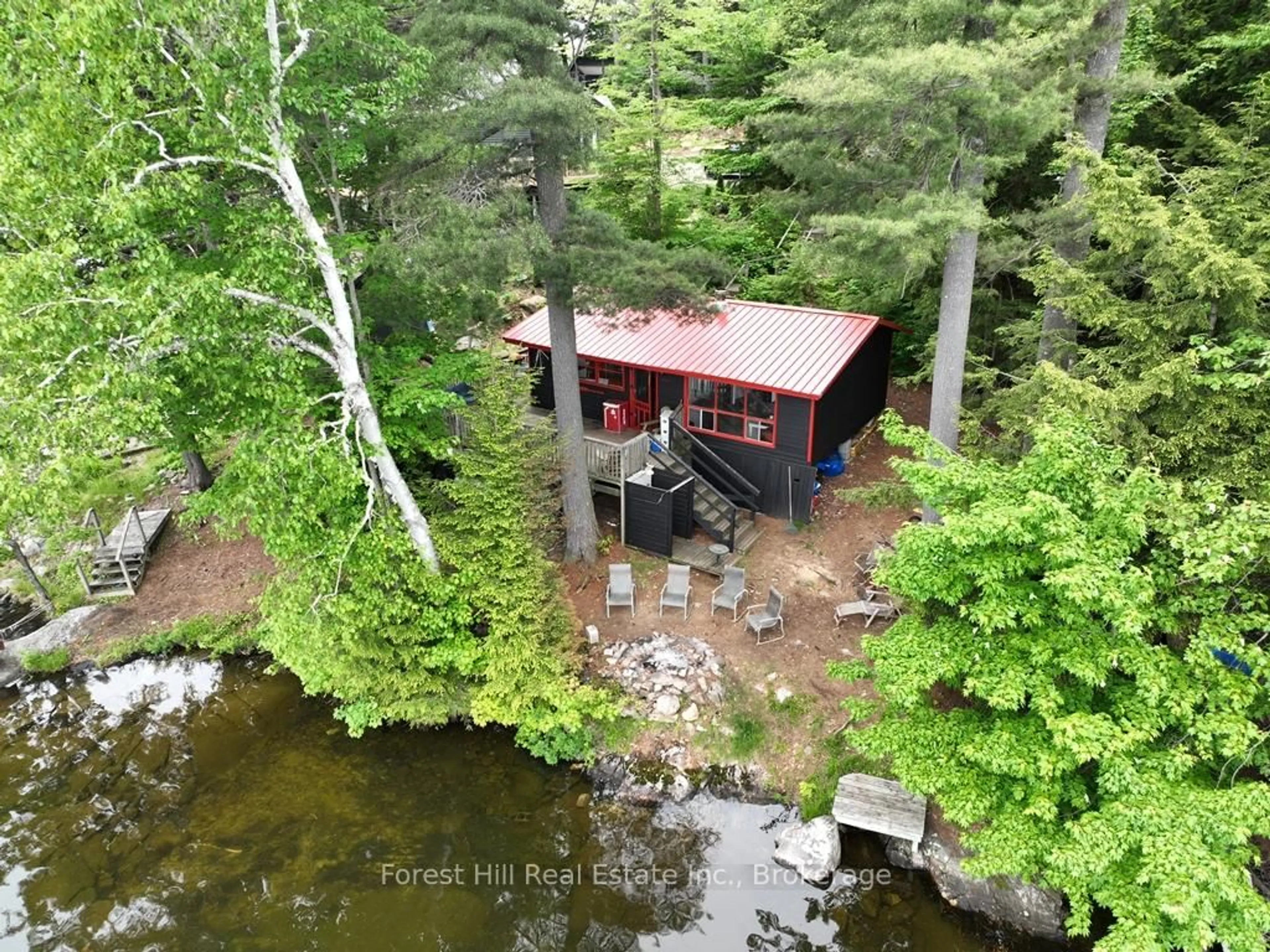 A pic from outside/outdoor area/front of a property/back of a property/a pic from drone, water/lake/river/ocean view for 1293 Causeway Dr, Algonquin Highlands Ontario P0A 1E0