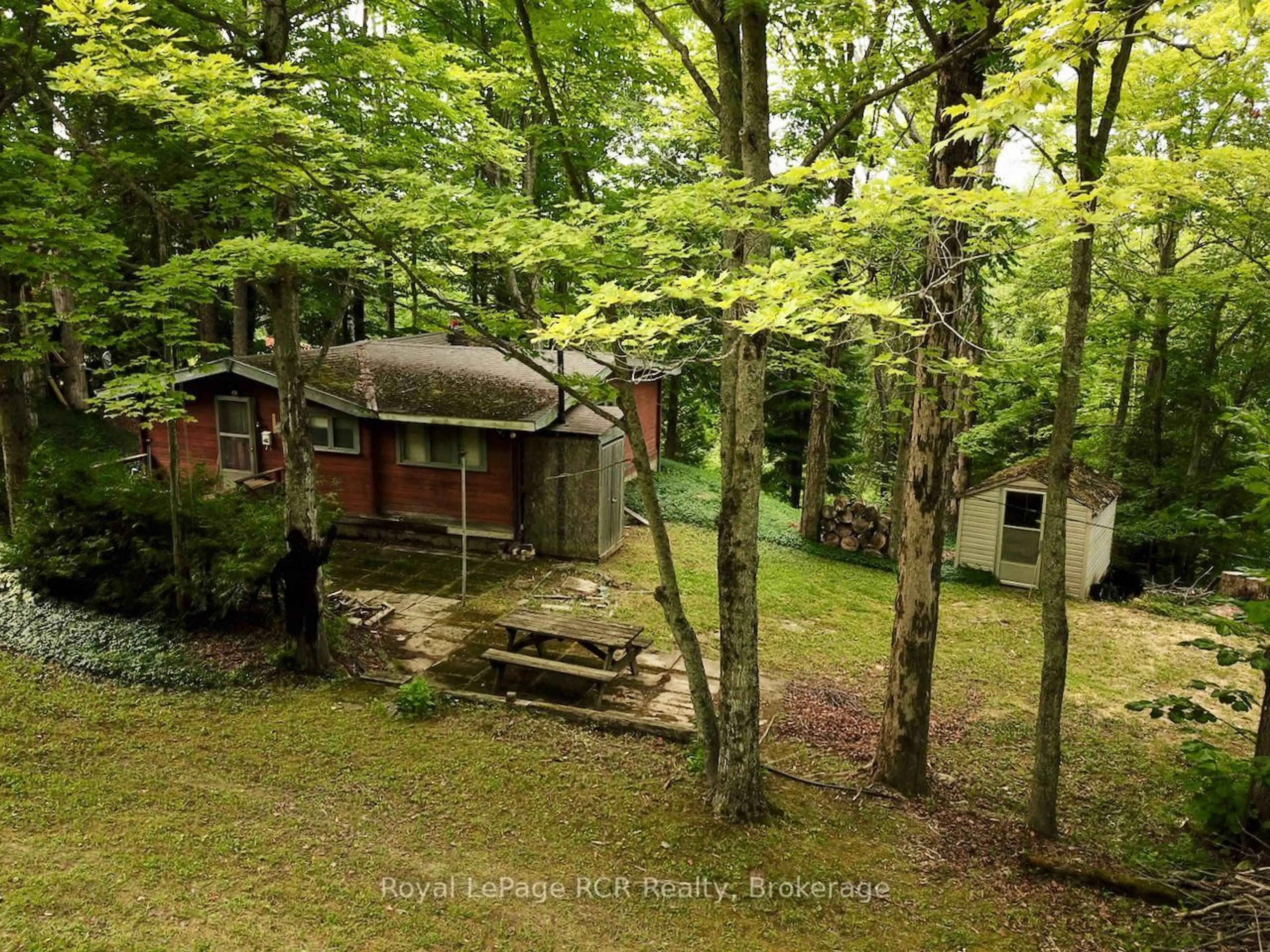 A pic from outside/outdoor area/front of a property/back of a property/a pic from drone, forest/trees view for 8 Marino Lane, South Bruce Peninsula Ontario N0H 2T0