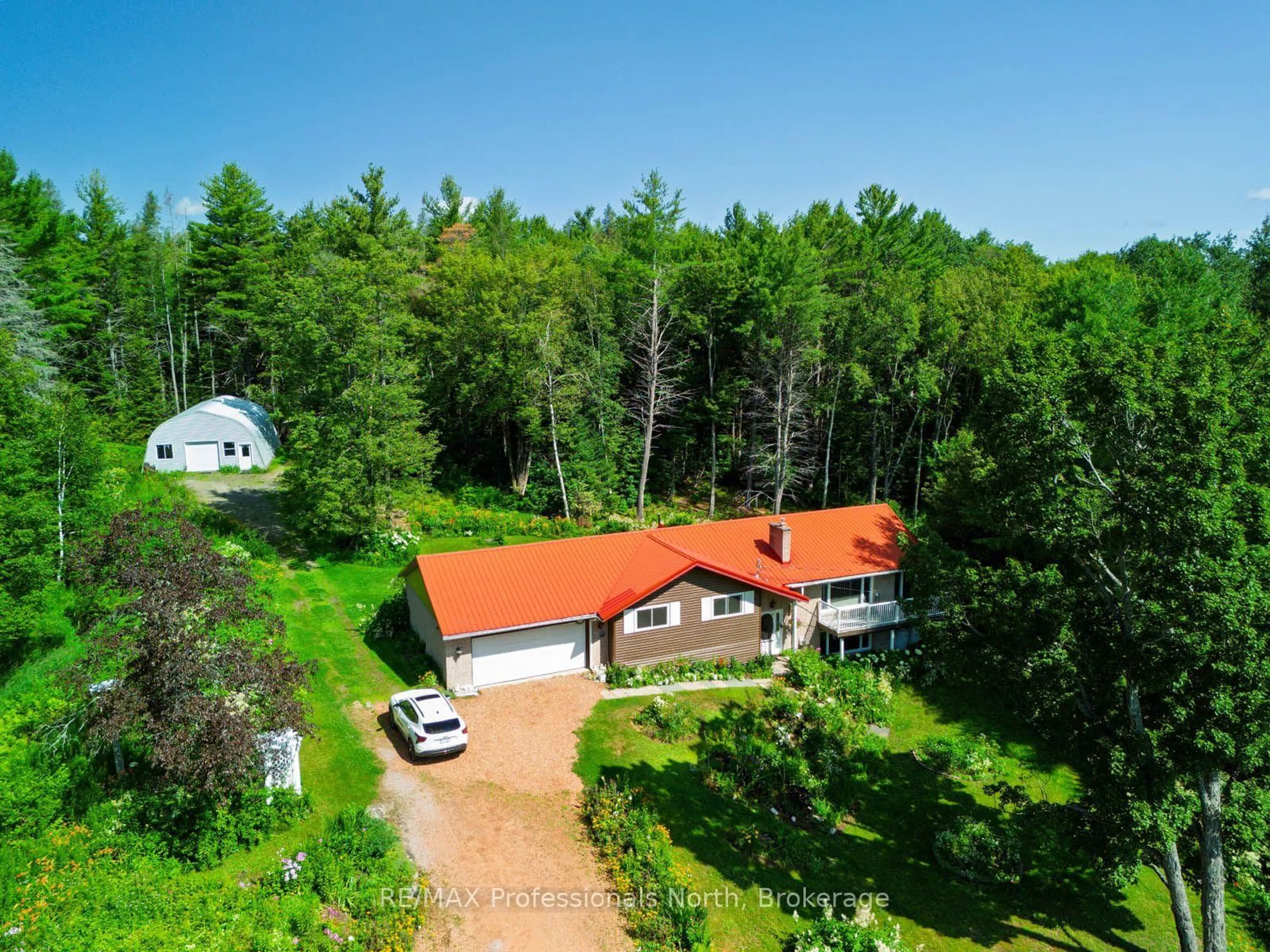 A pic from outside/outdoor area/front of a property/back of a property/a pic from drone, forest/trees view for 2501 Muskoka Road 117 Highway, Lake of Bays Ontario P0B 1A0