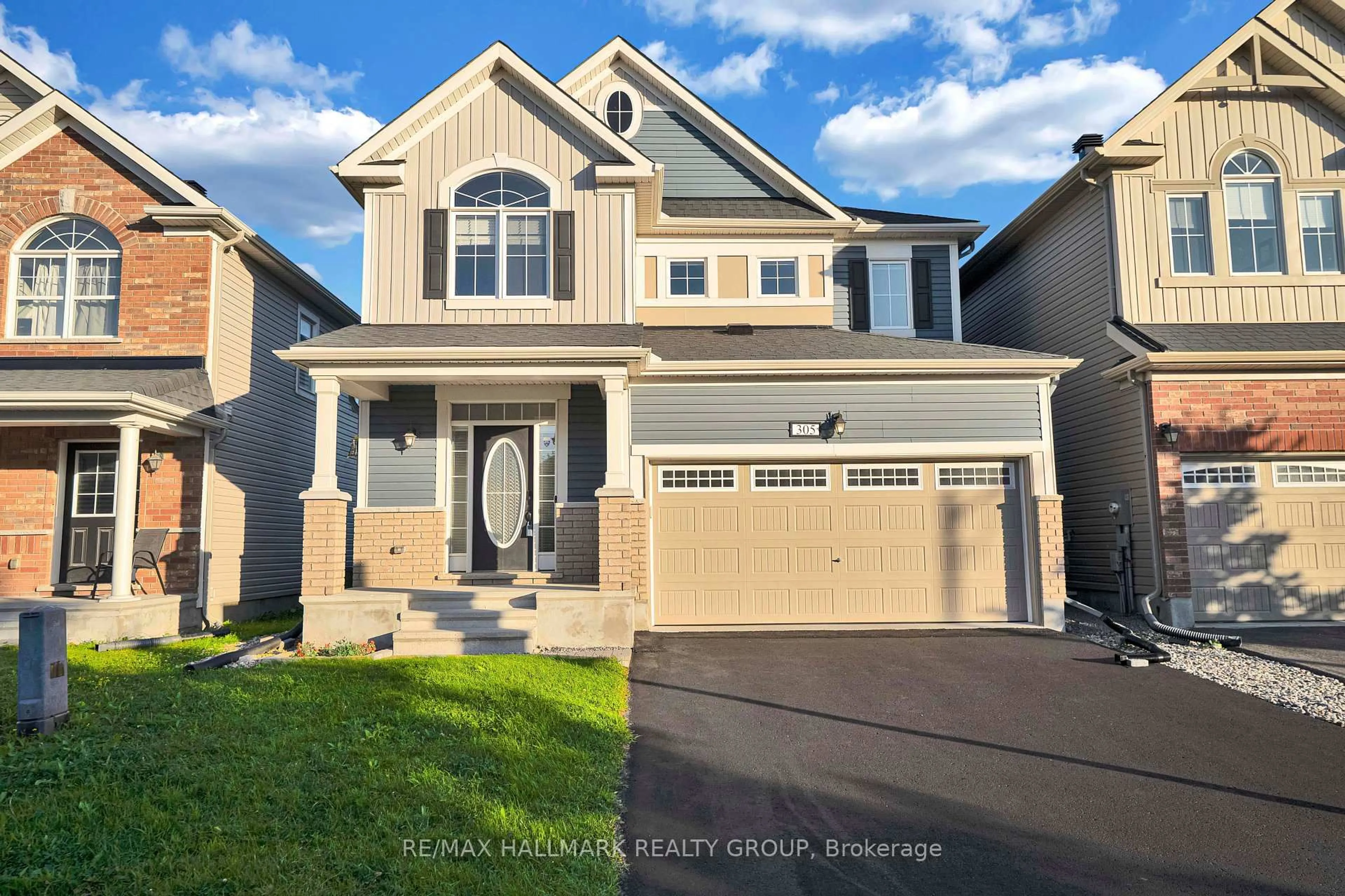 Home with vinyl exterior material, street for 305 Sweetclover Way, Ottawa Ontario K4A 1E6