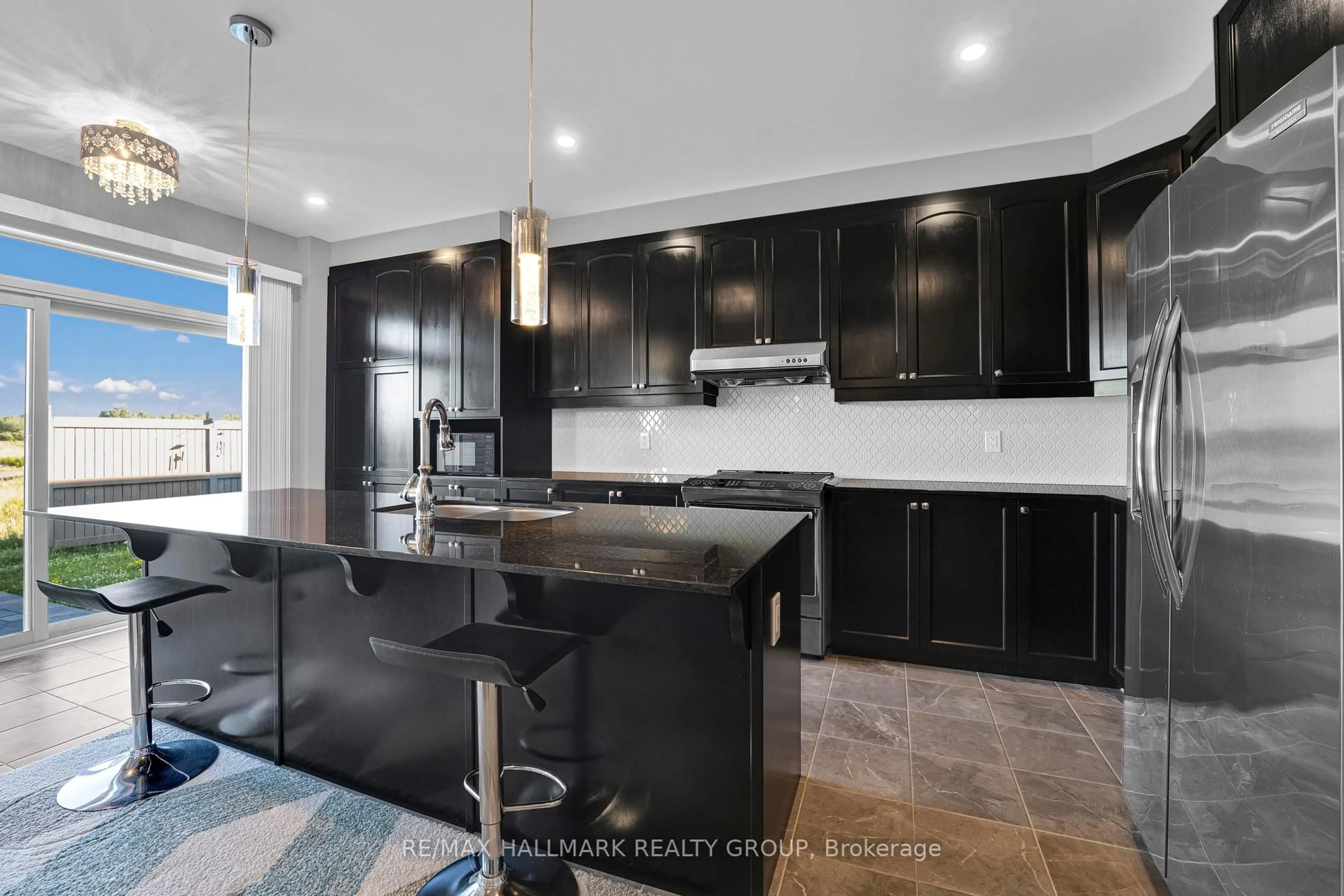 Open concept kitchen, ceramic/tile floor for 305 Sweetclover Way, Ottawa Ontario K4A 1E6