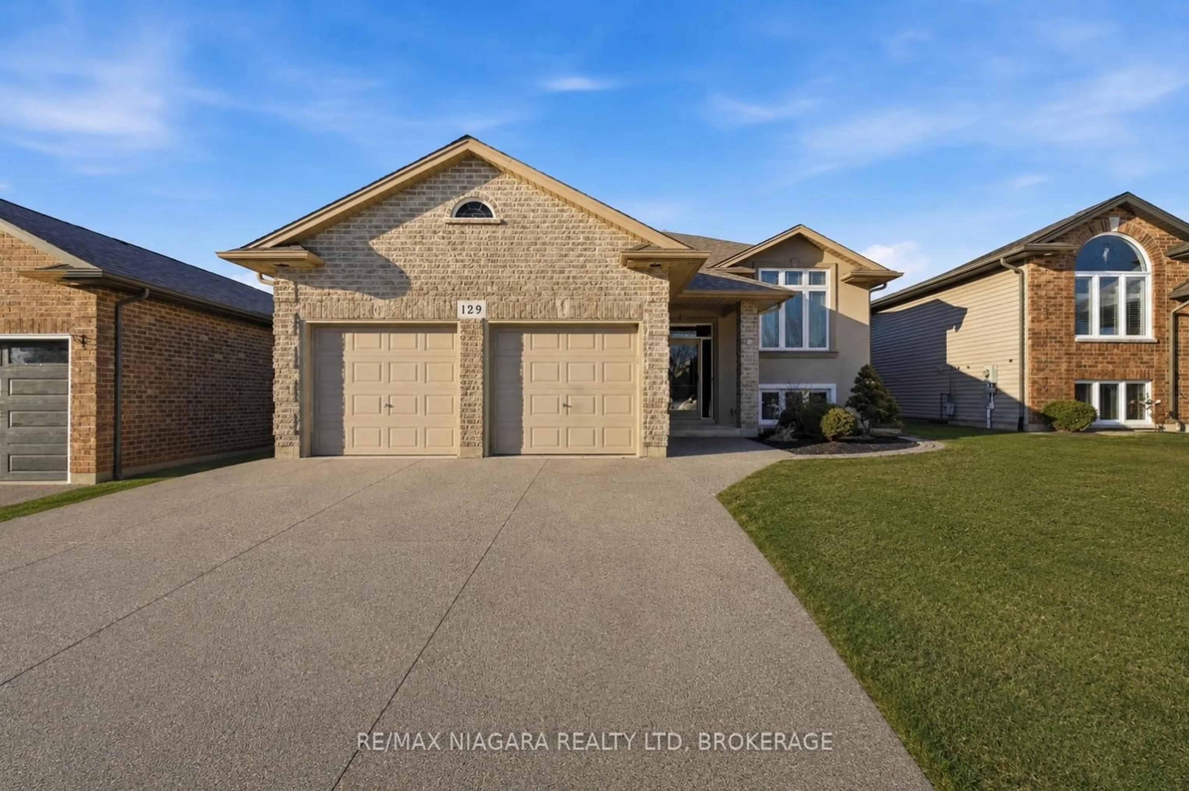Home with brick exterior material, street for 129 Wellbrook Ave, Welland Ontario L3C 7M8