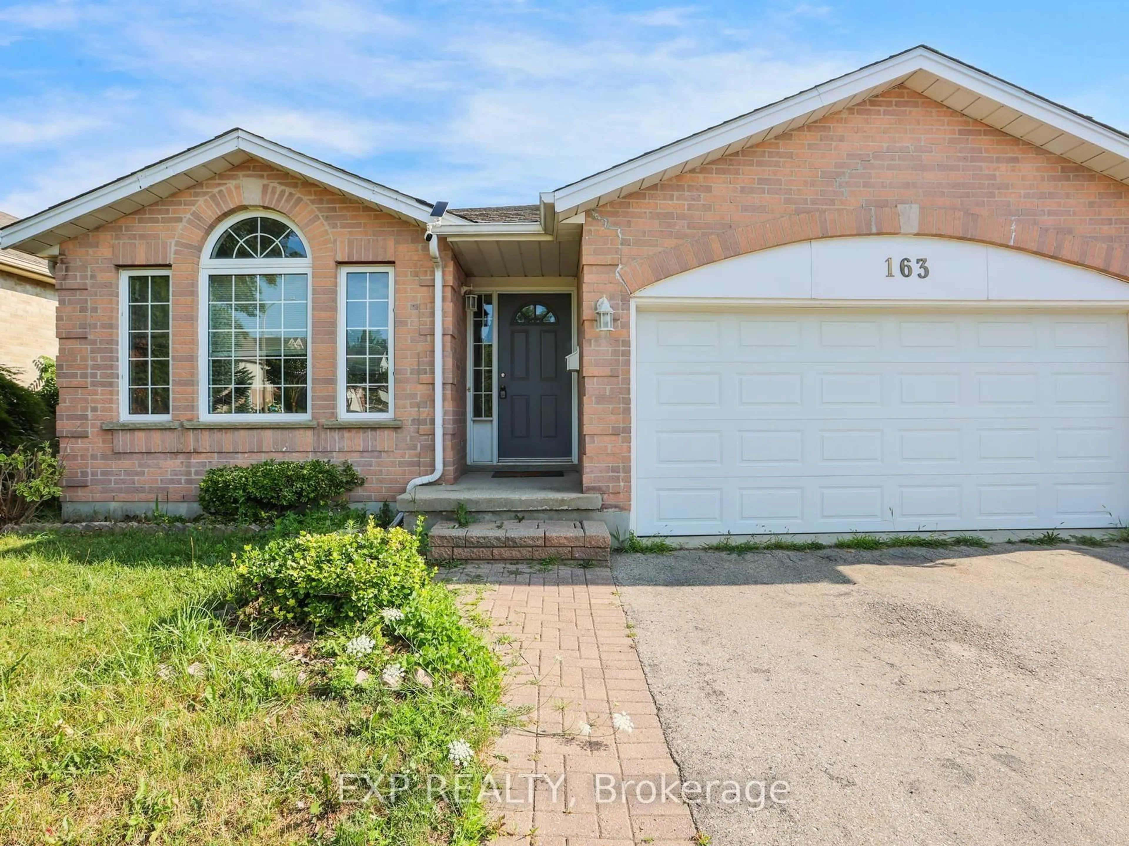 Home with brick exterior material, street for 163 Daimler Dr, Kitchener Ontario N2A 4C7