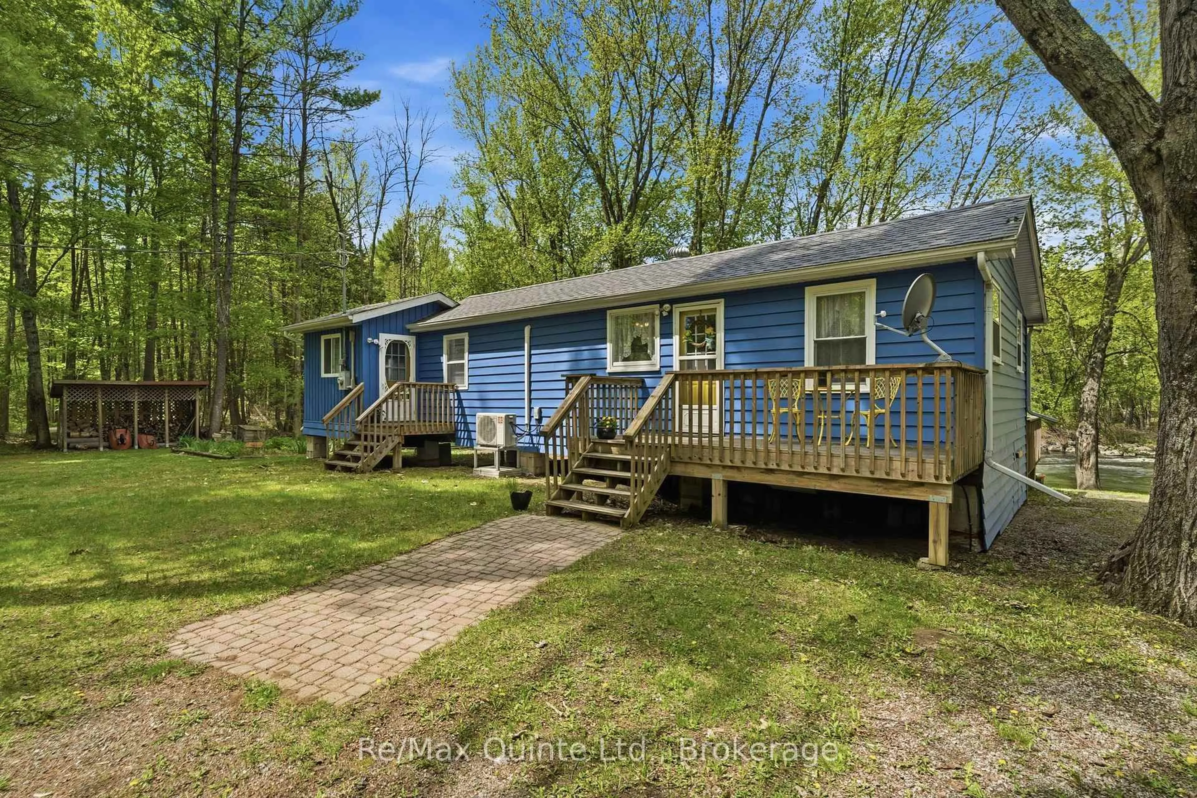 A pic from outside/outdoor area/front of a property/back of a property/a pic from drone, water/lake/river/ocean view for 122 Cottage Lane, Tweed Ontario K0K 3J0