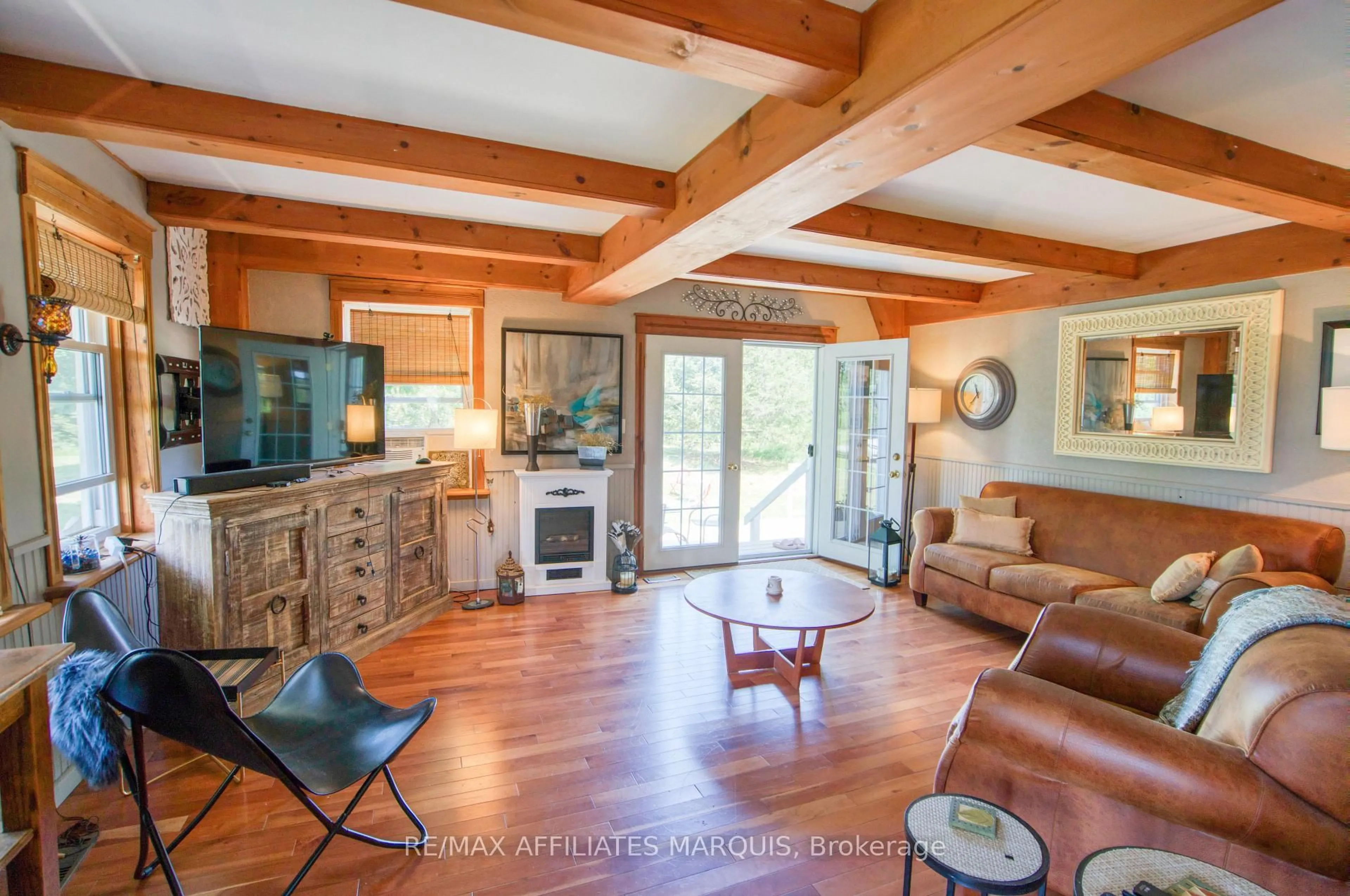 Living room with furniture, wood/laminate floor for 531 Little Crosby Lake Rd, Rideau Lakes Ontario K0G 1X0