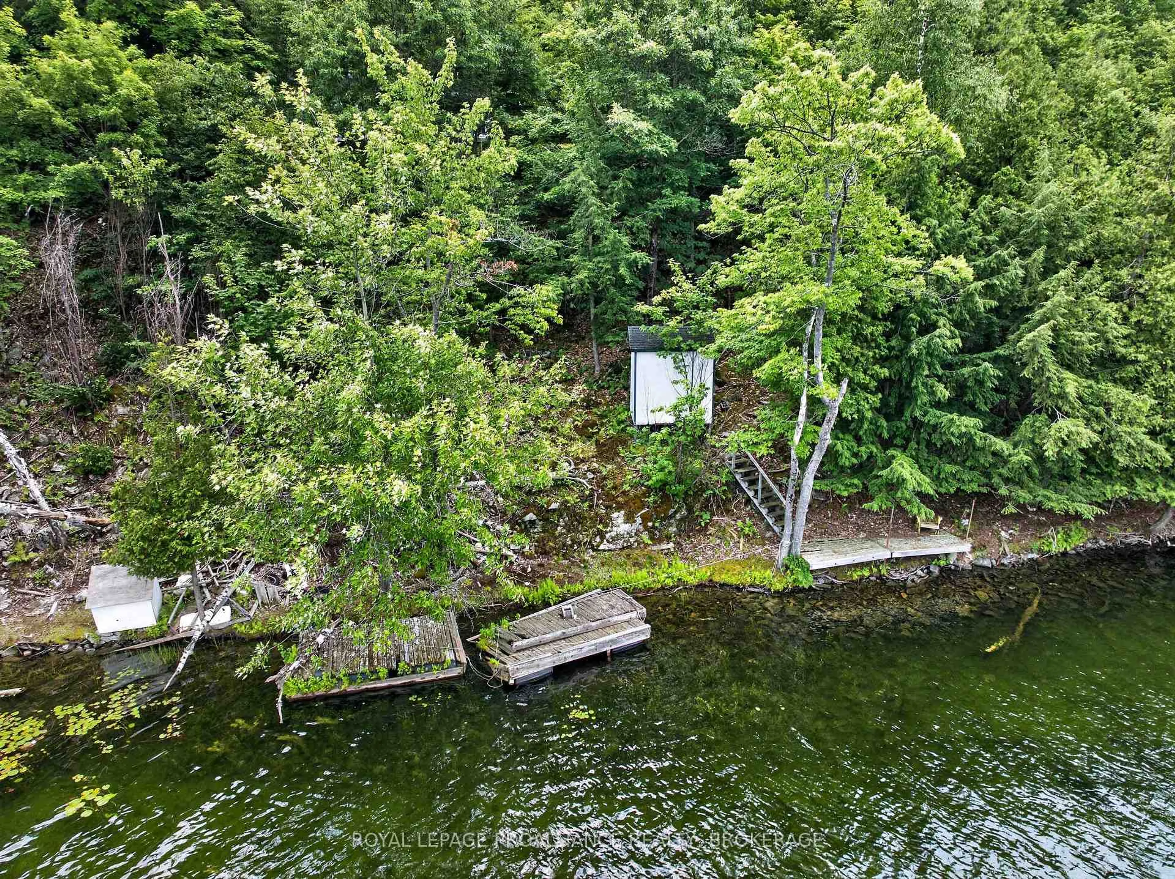 A pic from outside/outdoor area/front of a property/back of a property/a pic from drone, water/lake/river/ocean view for 119 Cliff View Lane, Westport Ontario K0G 1X0
