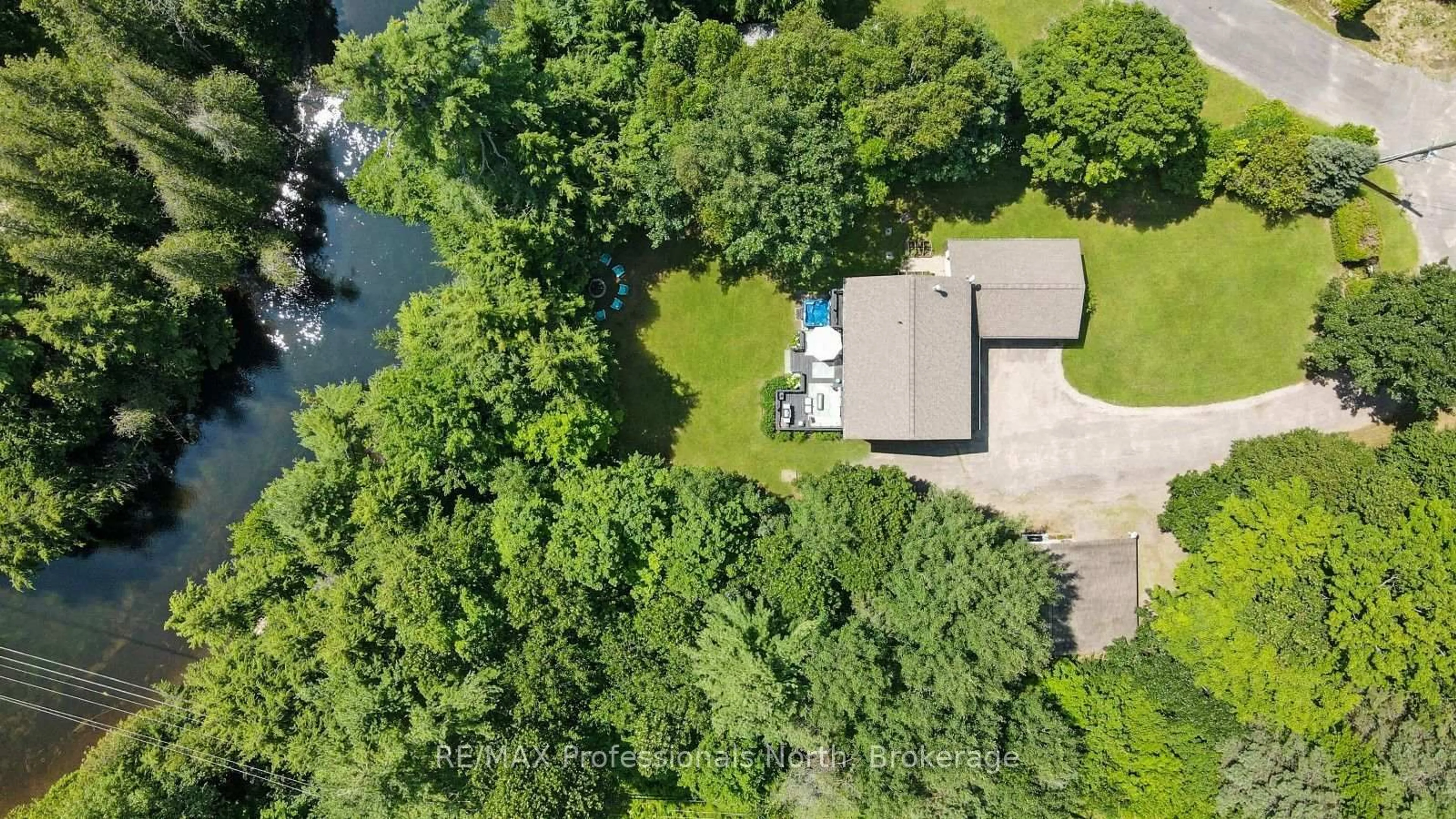 A pic from outside/outdoor area/front of a property/back of a property/a pic from drone, water/lake/river/ocean view for 1057 Suburban Crt, Dysart et al Ontario K0M 2S0