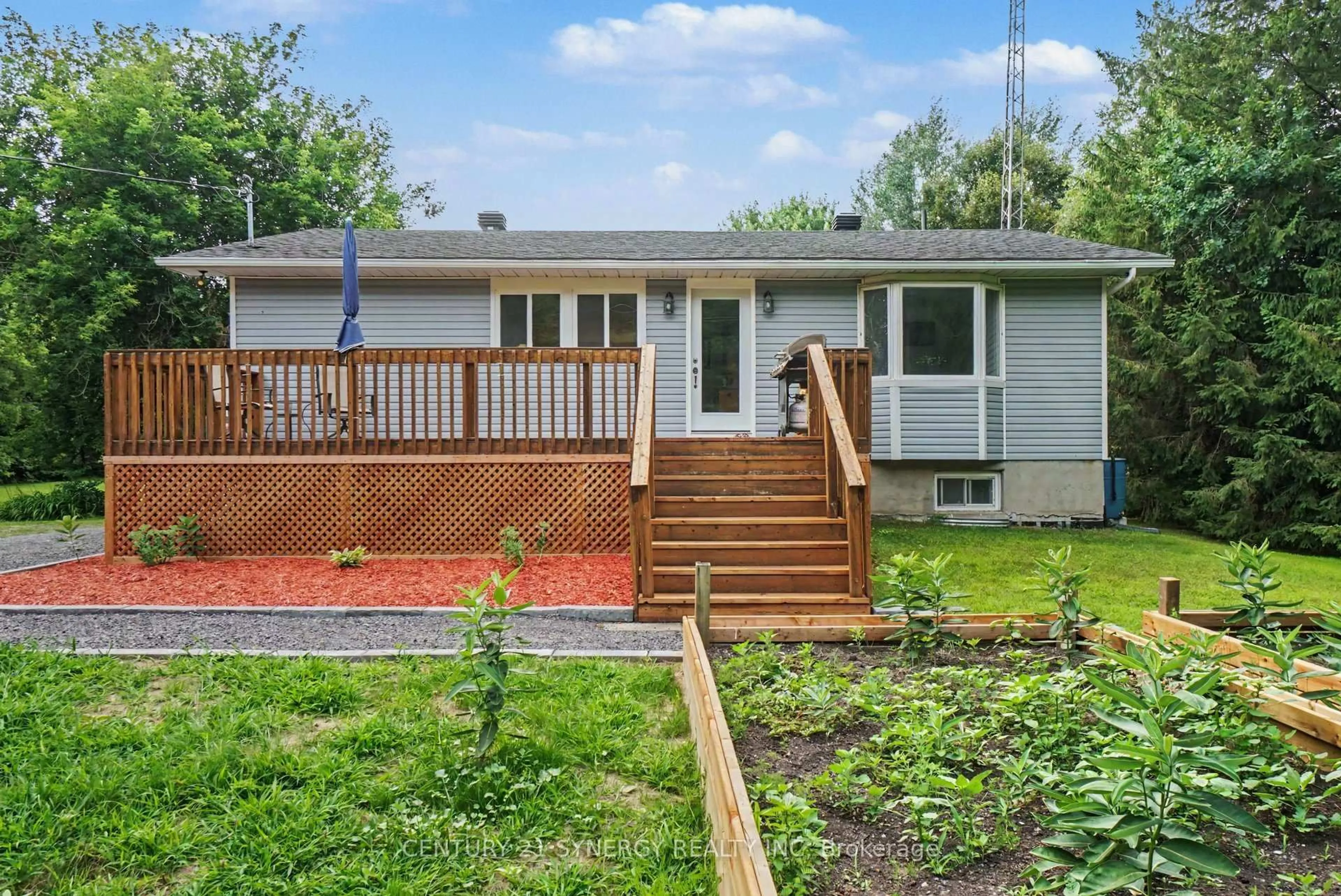 Home with vinyl exterior material, street for 1409 Baker Rd, The Nation Ontario K0A 1M0