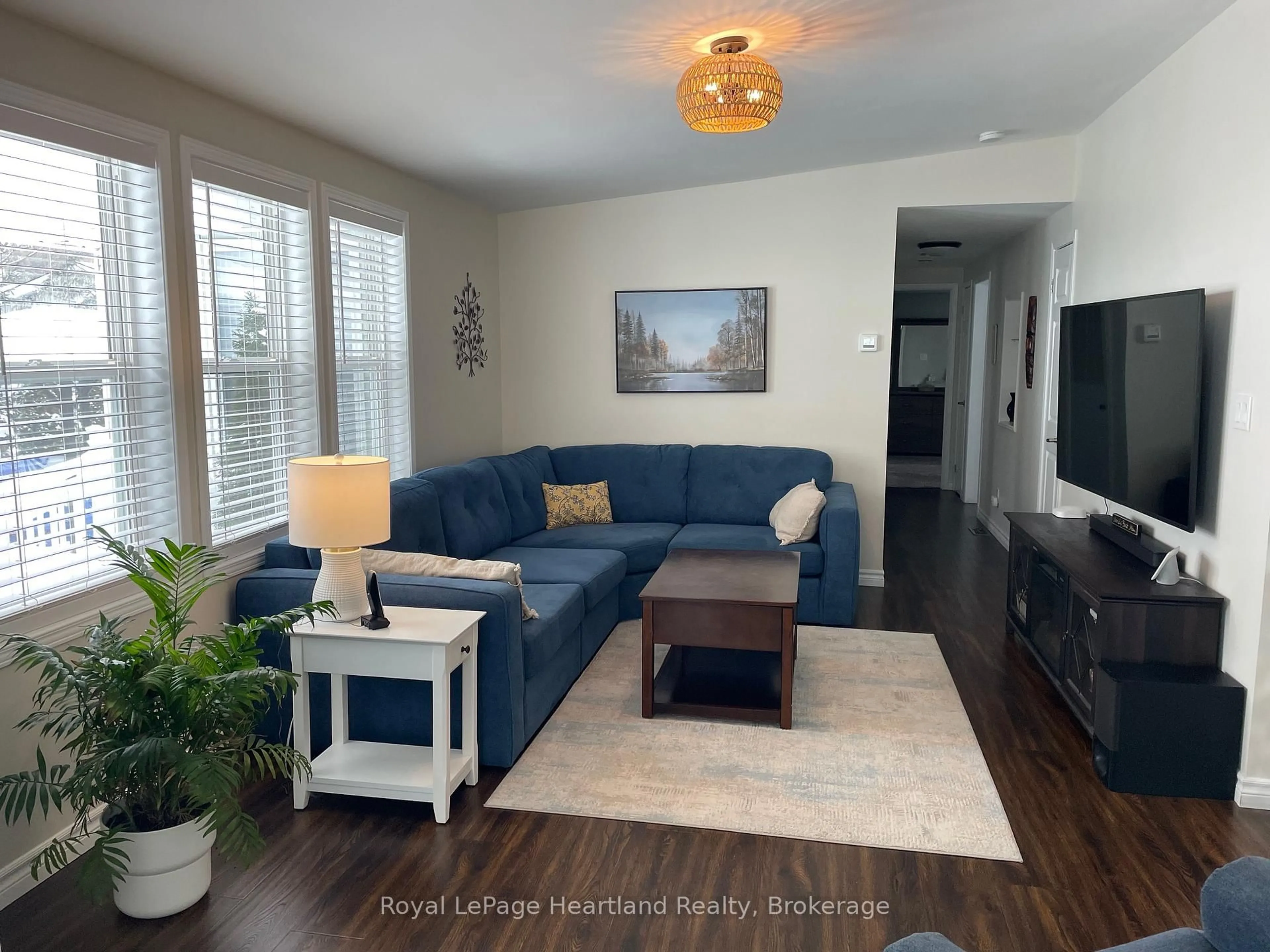 Living room with furniture, wood/laminate floor for 15 Huron Lane, Ashfield-Colborne-Wawanosh Ontario N7A 3Y2