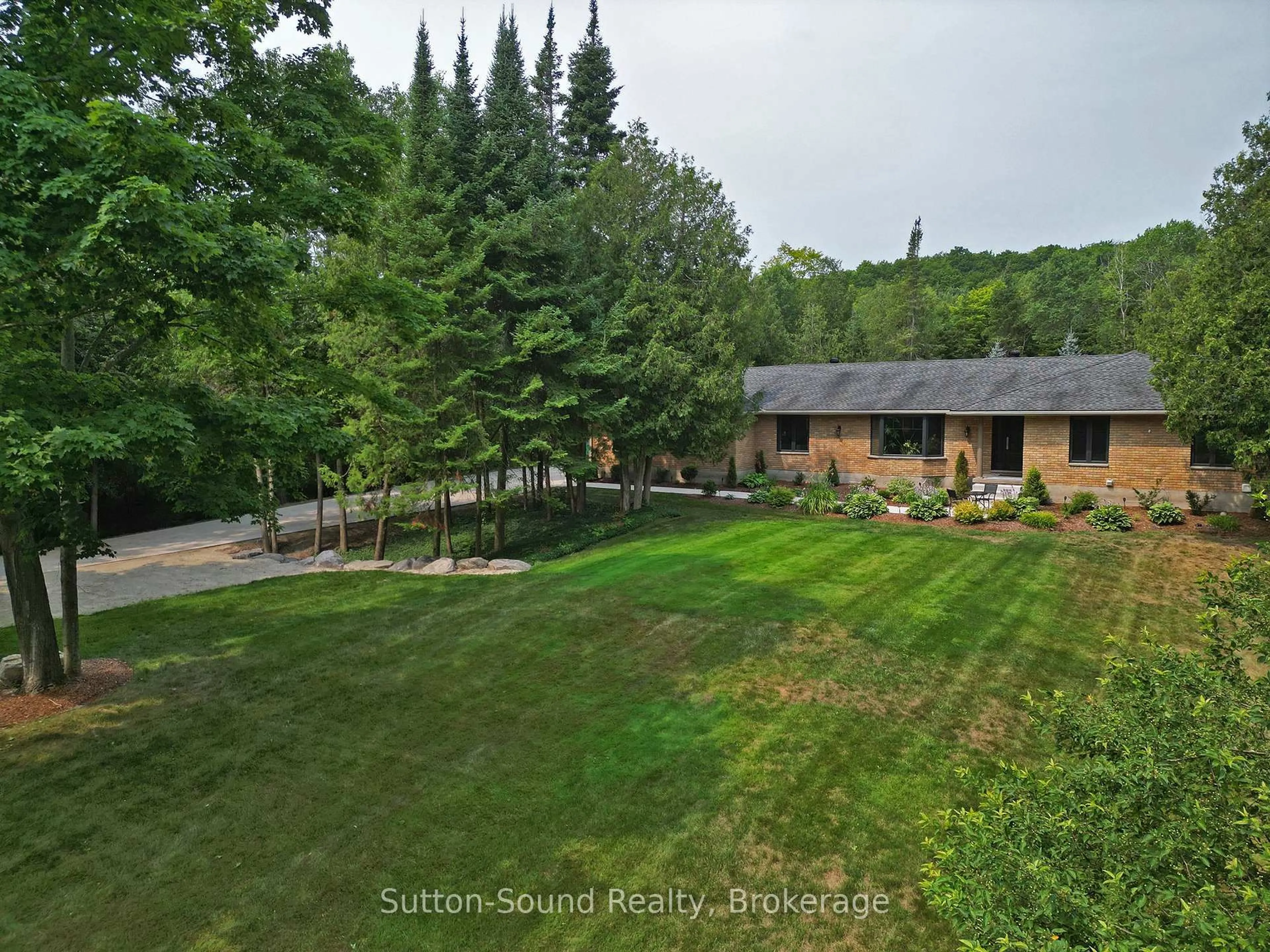A pic from outside/outdoor area/front of a property/back of a property/a pic from drone, forest/trees view for 286 Balmy Beach Rd, Georgian Bluffs Ontario N4K 5N4