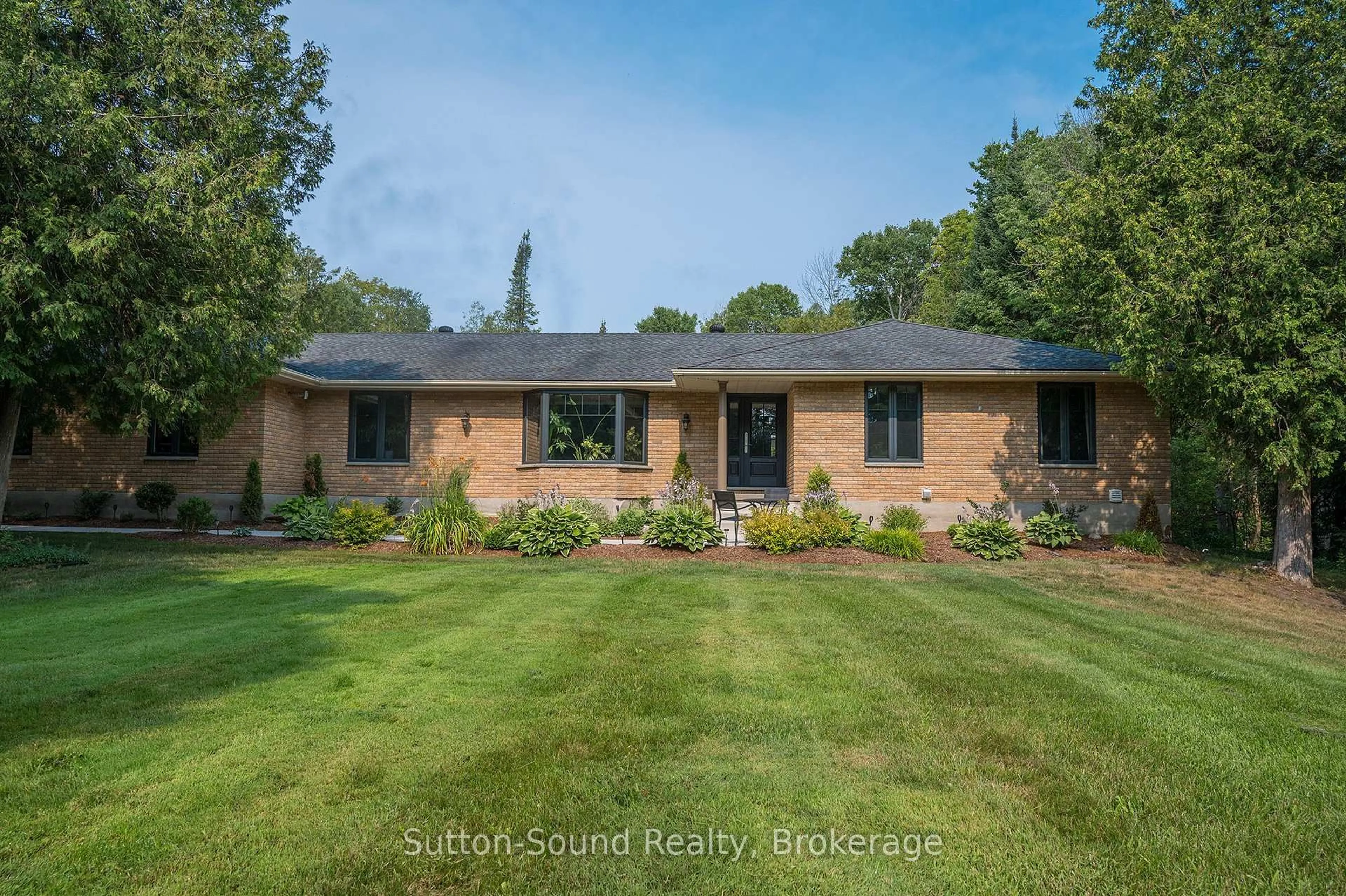 Home with brick exterior material, street for 286 Balmy Beach Rd, Georgian Bluffs Ontario N4K 5N4