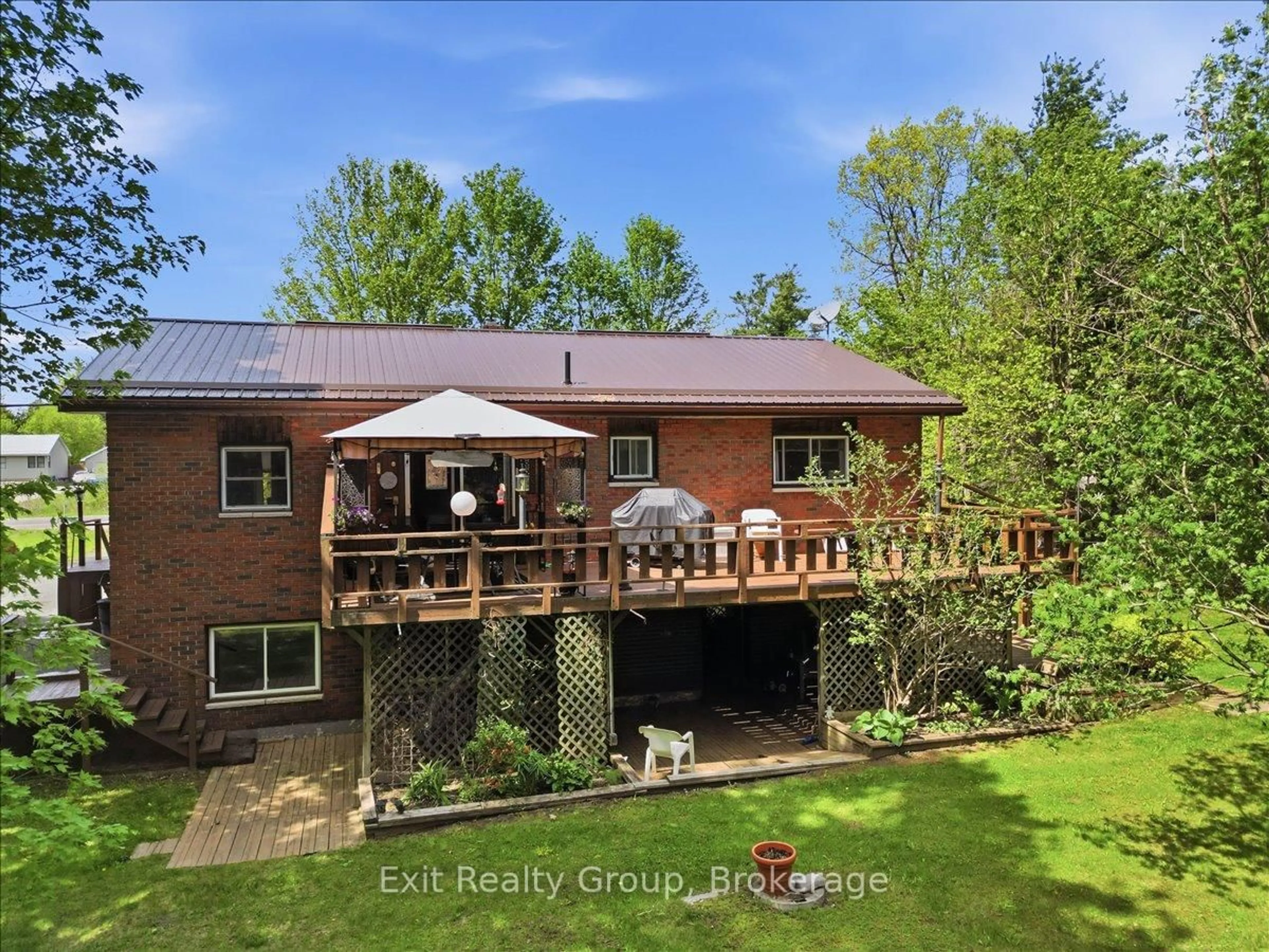 A pic from outside/outdoor area/front of a property/back of a property/a pic from drone, water/lake/river/ocean view for 102836 Highway 7, Limoges Ontario K0K 2M0