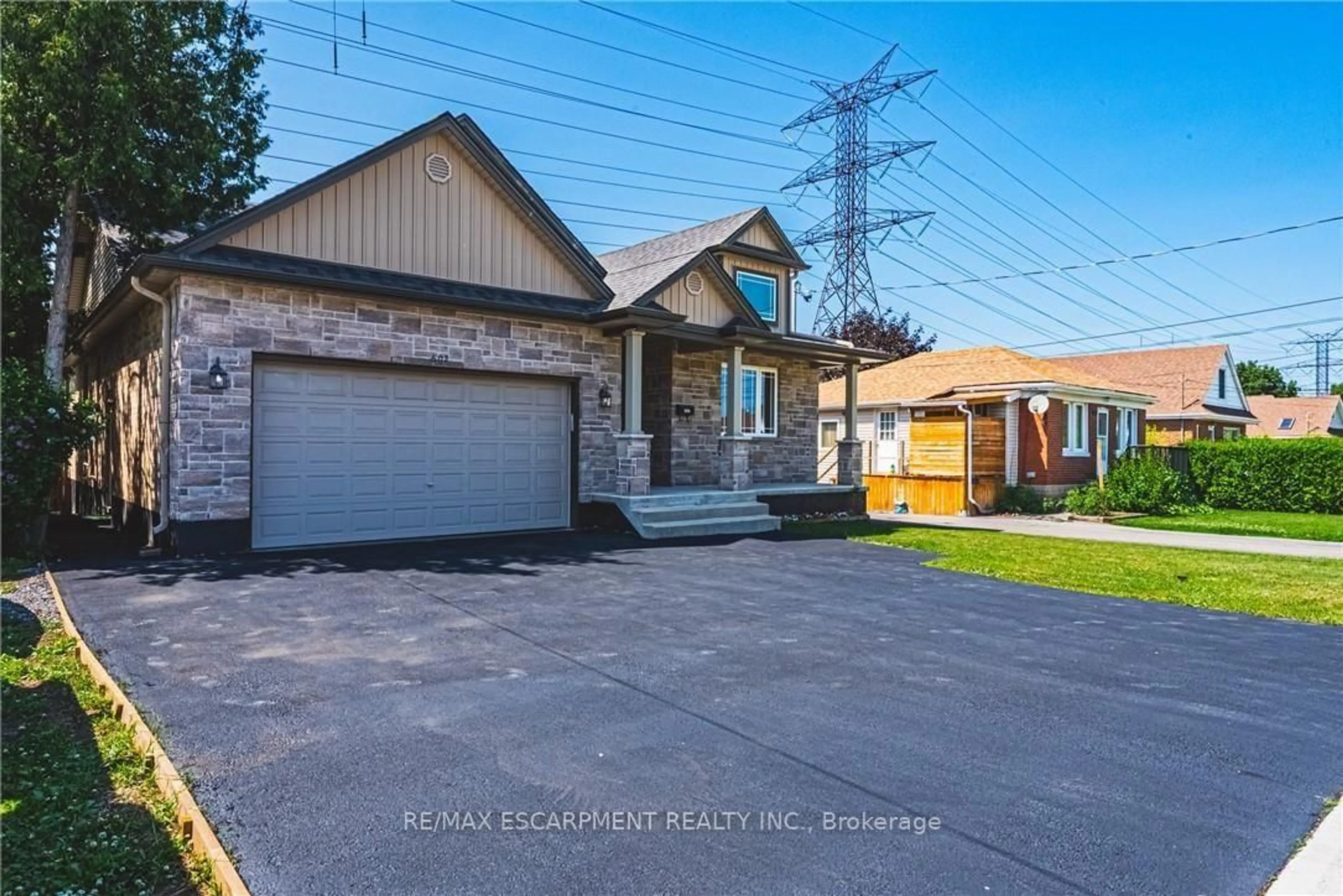 Home with brick exterior material, street for 602 Cochrane Rd, Hamilton Ontario L8K 3H6