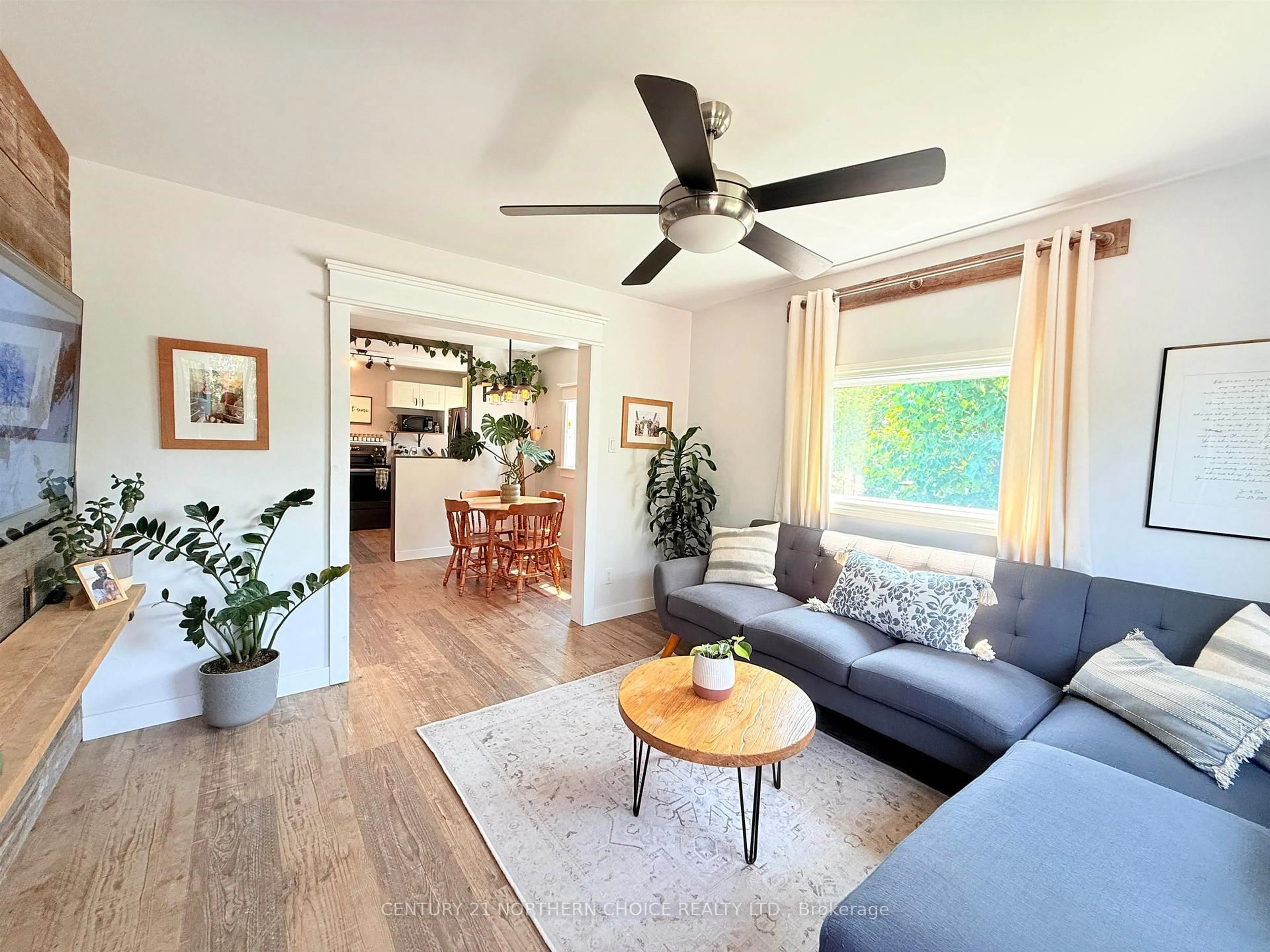 Living room with furniture, wood/laminate floor for 36 Robert St, Sioux Lookout Ontario P8T 1C8