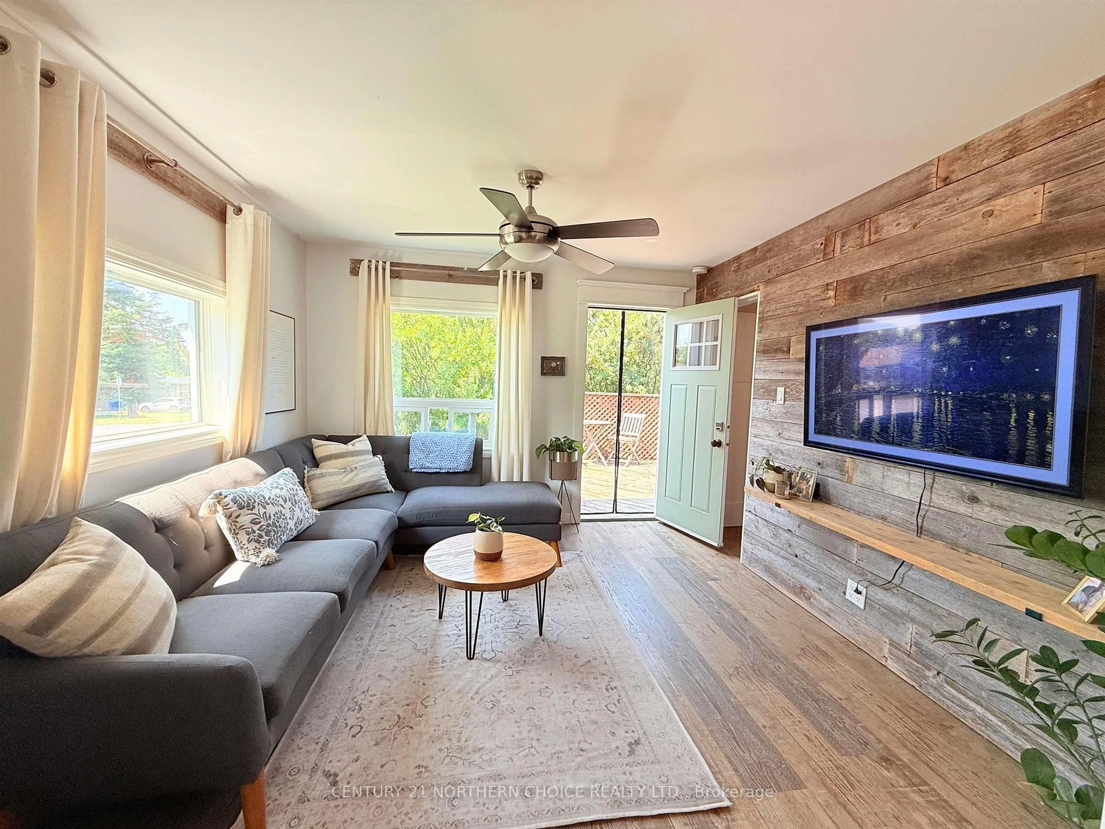Living room with furniture, wood/laminate floor for 36 Robert St, Sioux Lookout Ontario P8T 1C8