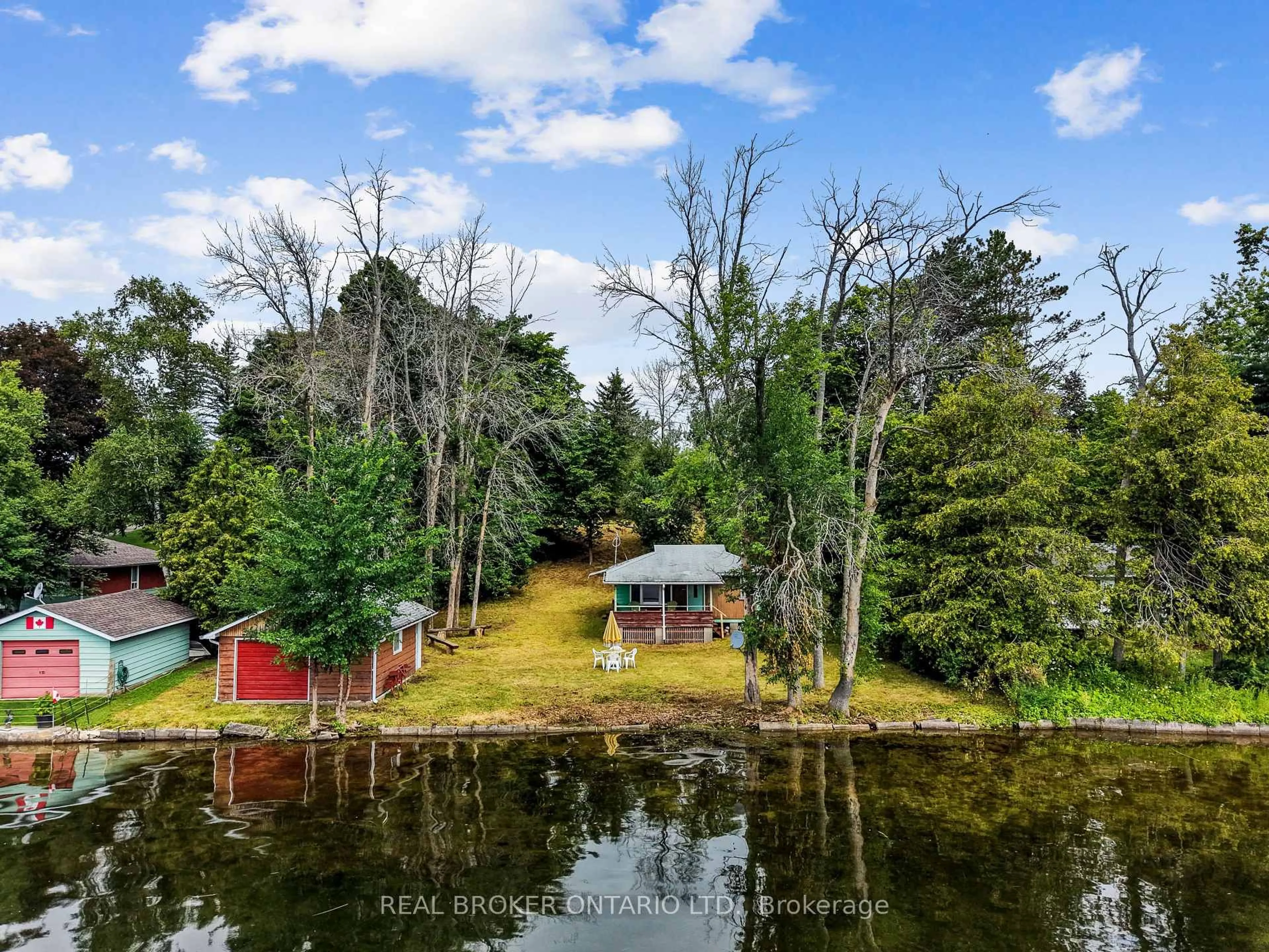 A pic from outside/outdoor area/front of a property/back of a property/a pic from drone, water/lake/river/ocean view for 1839 Young's Point Rd, Selwyn Ontario K0L 2H0