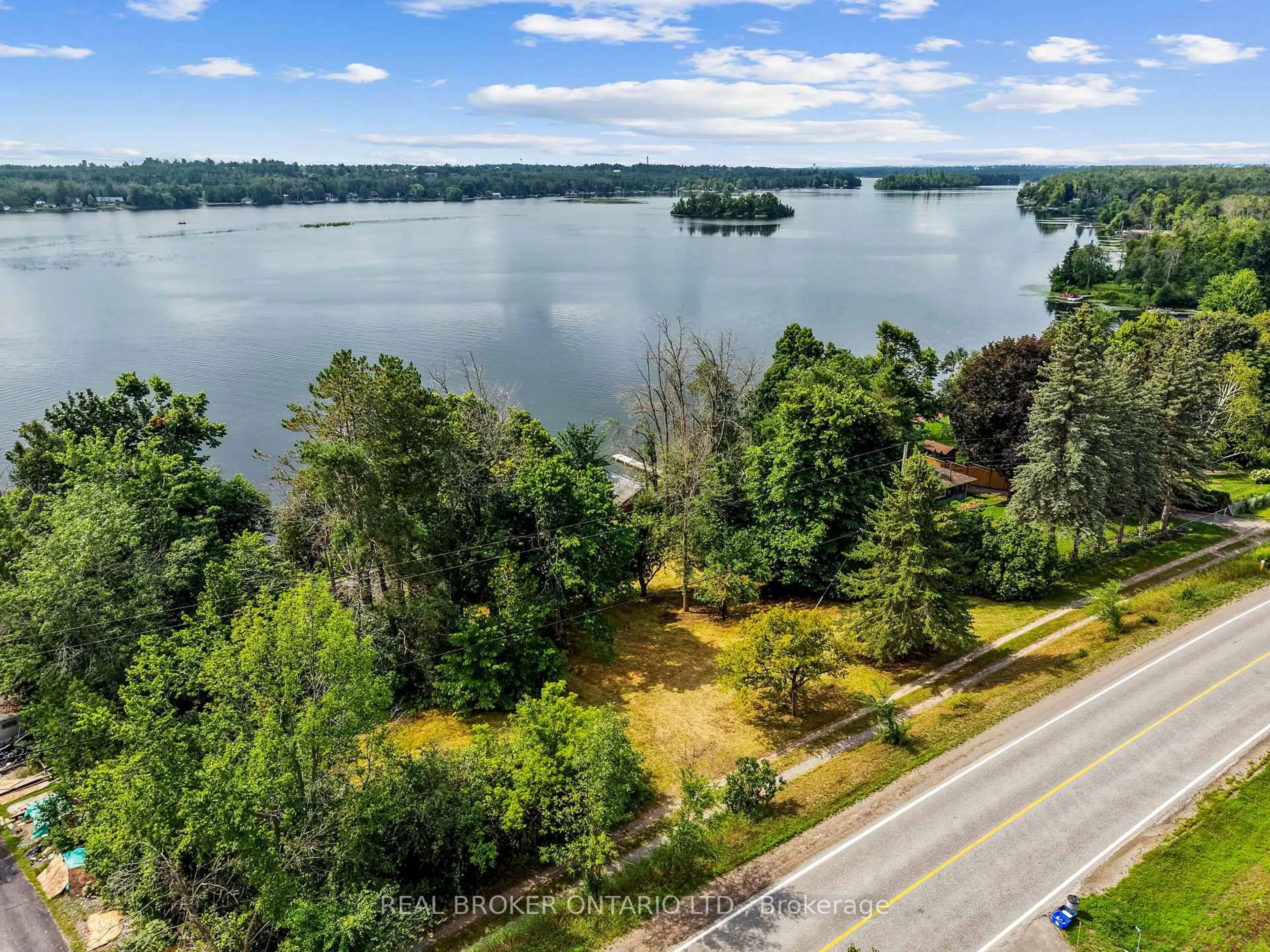 A pic from outside/outdoor area/front of a property/back of a property/a pic from drone, water/lake/river/ocean view for 1839 Young's Point Rd, Selwyn Ontario K0L 2H0