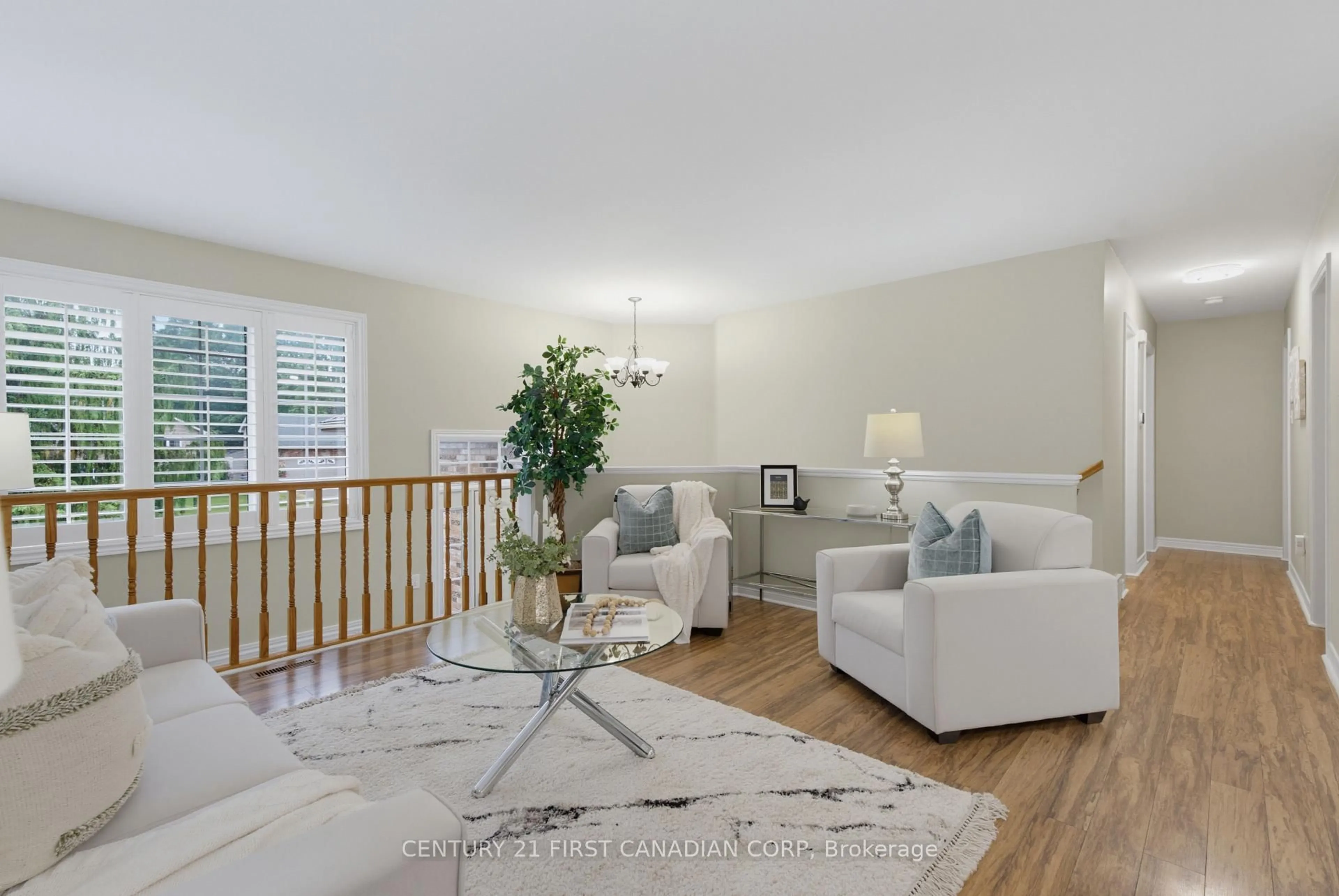 Living room with furniture, wood/laminate floor for 189 GIBSON Cres, Lucan Biddulph Ontario N0M 2J0