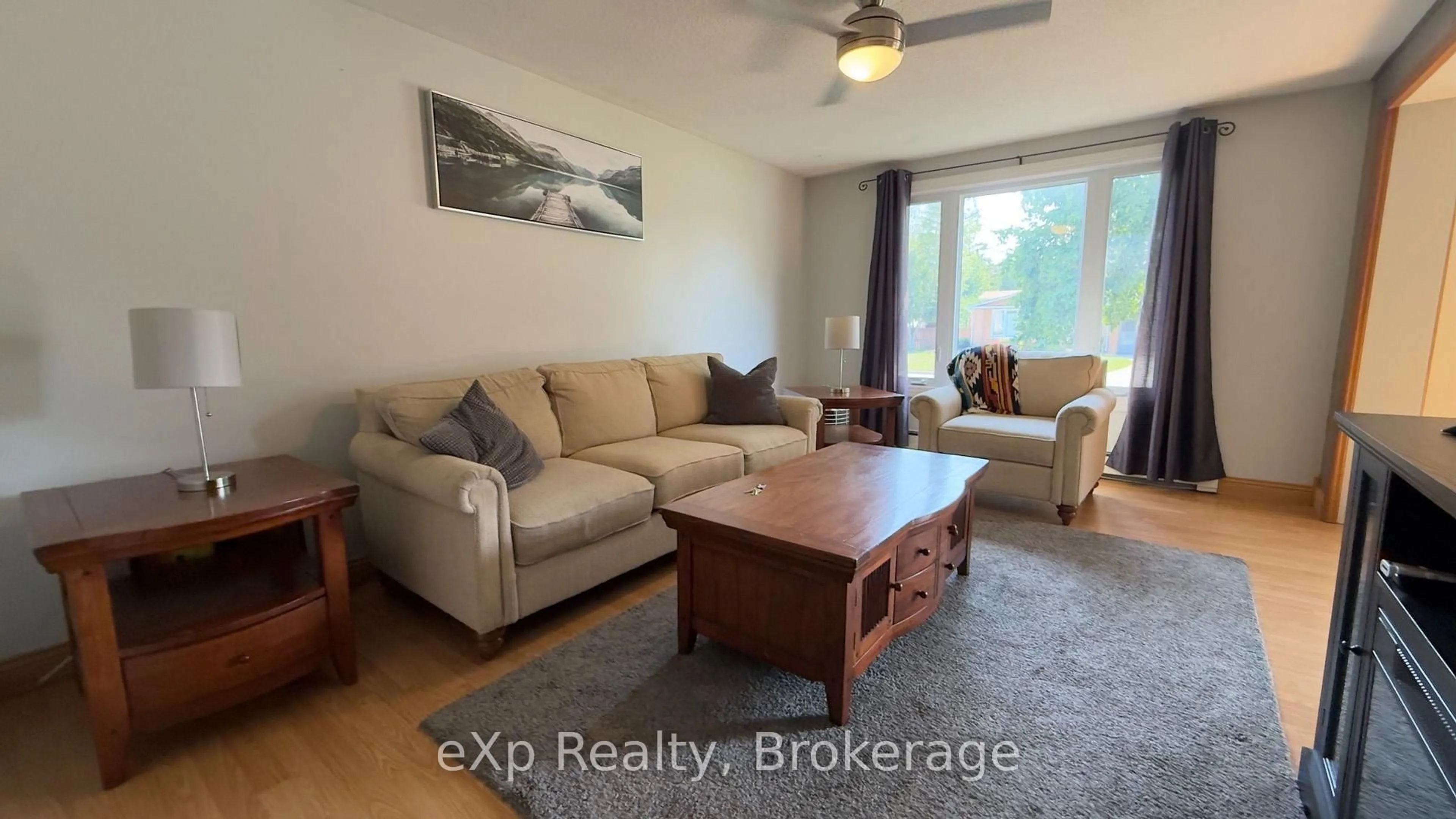 Living room with furniture, wood/laminate floor for 403 Highland Dr, Kincardine Ontario N2Z 1X3