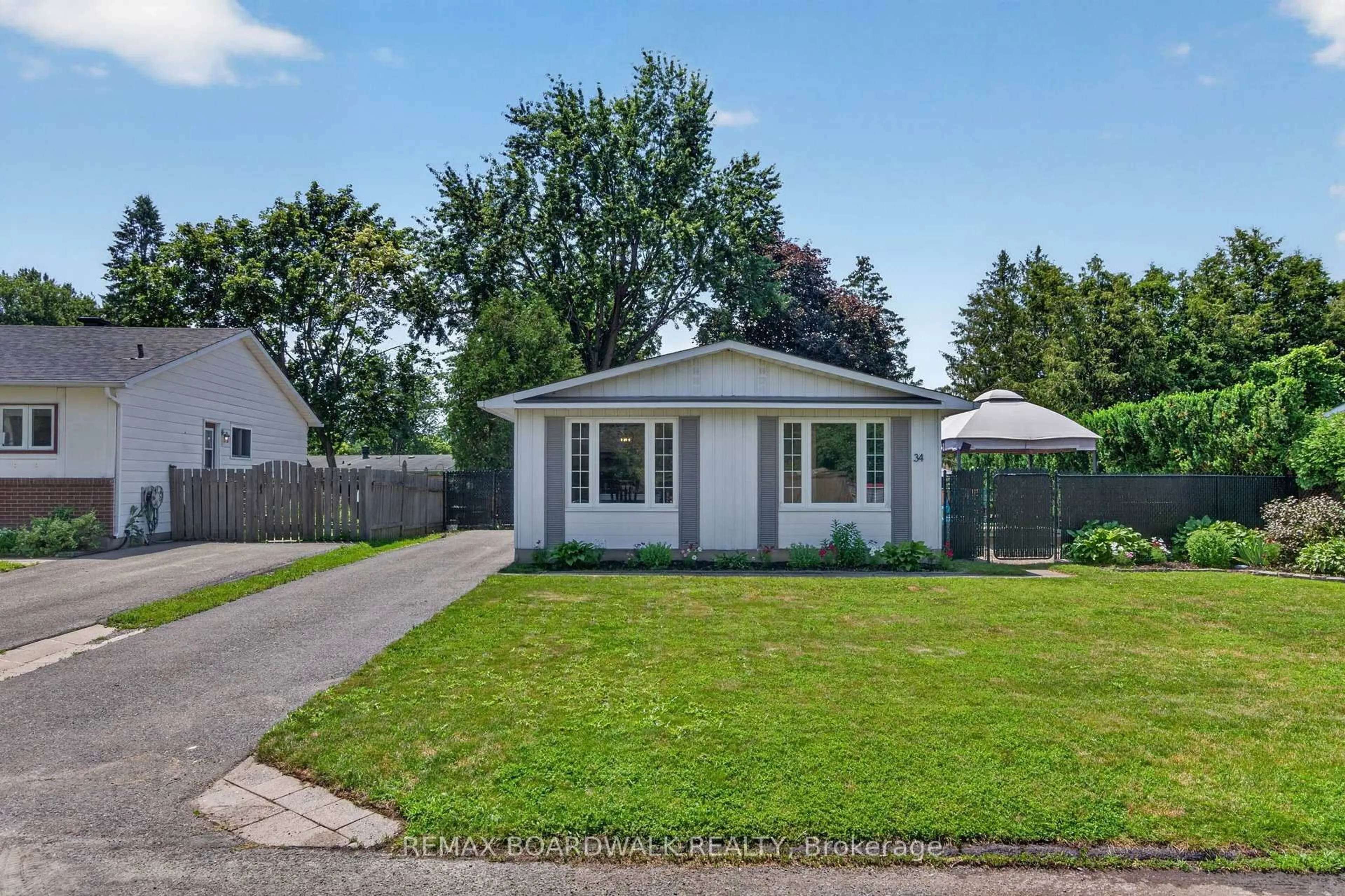 Home with vinyl exterior material, street for 34 Binscarth Cres, Kanata Ontario K2L 1S1