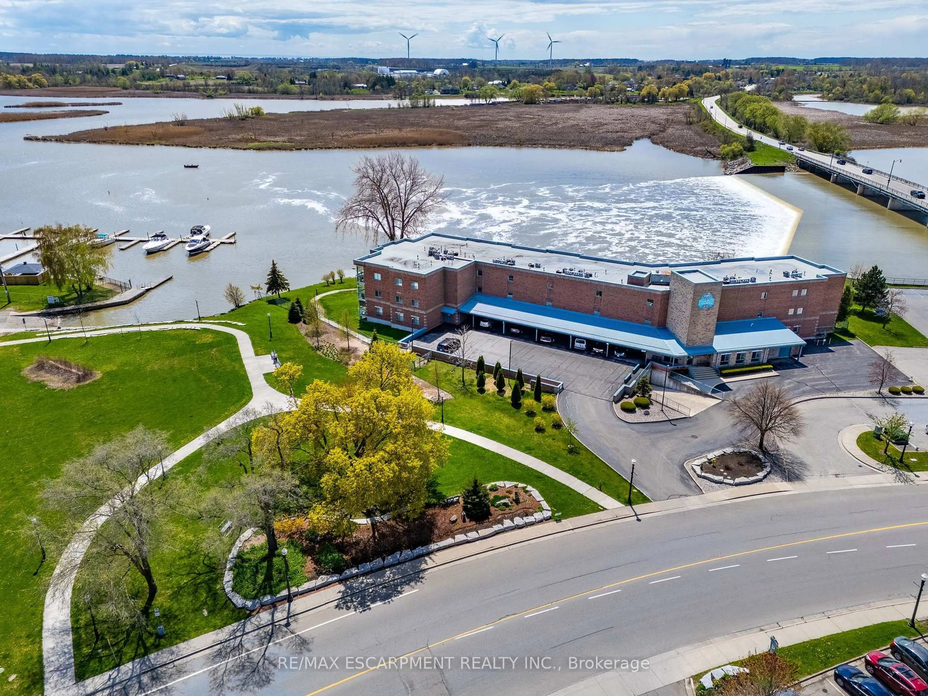 A pic from outside/outdoor area/front of a property/back of a property/a pic from drone, water/lake/river/ocean view for 210 Main St #309, Haldimand Ontario N1A 3G7