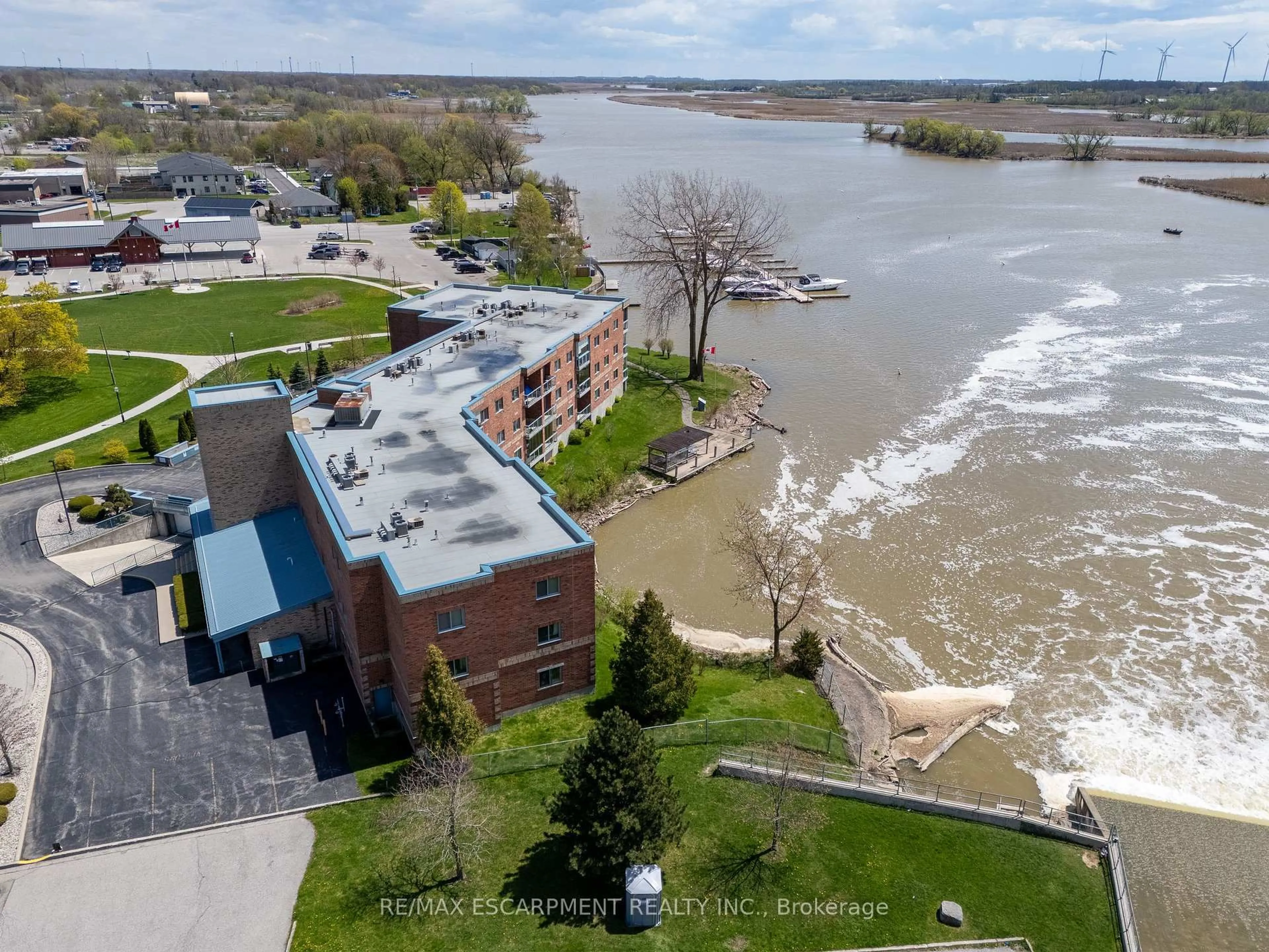 A pic from outside/outdoor area/front of a property/back of a property/a pic from drone, water/lake/river/ocean view for 210 Main St #309, Haldimand Ontario N1A 3G7